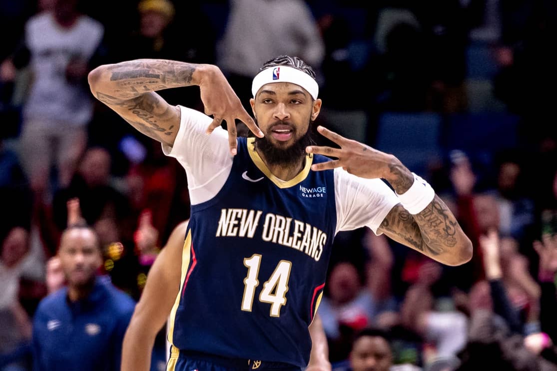Dec 5, 2024; New Orleans, Louisiana, USA; New Orleans Pelicans forward Brandon Ingram (14) reacts to making a three point basket against the Phoenix Suns during the first half at Smoothie King Center. Mandatory Credit: Stephen Lew-Imagn Images