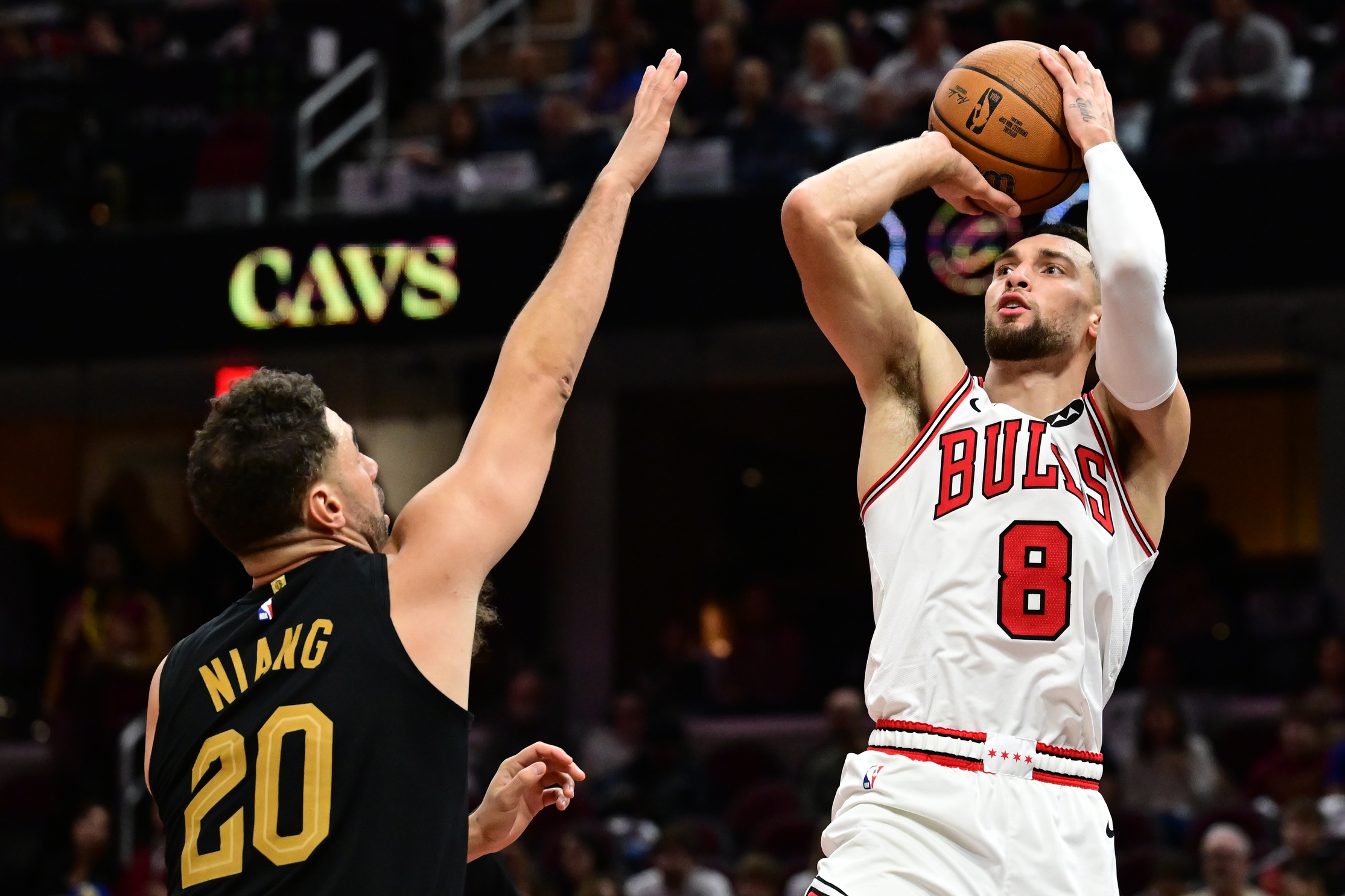 Chicago Bulls guard Zach LaVine (8) shoots over the defense of Cleveland Cavaliers forward Georges Niang (20) during the second half at Rocket Mortgage FieldHouse. Mandatory Credit: Ken Blaze-Imagn Images