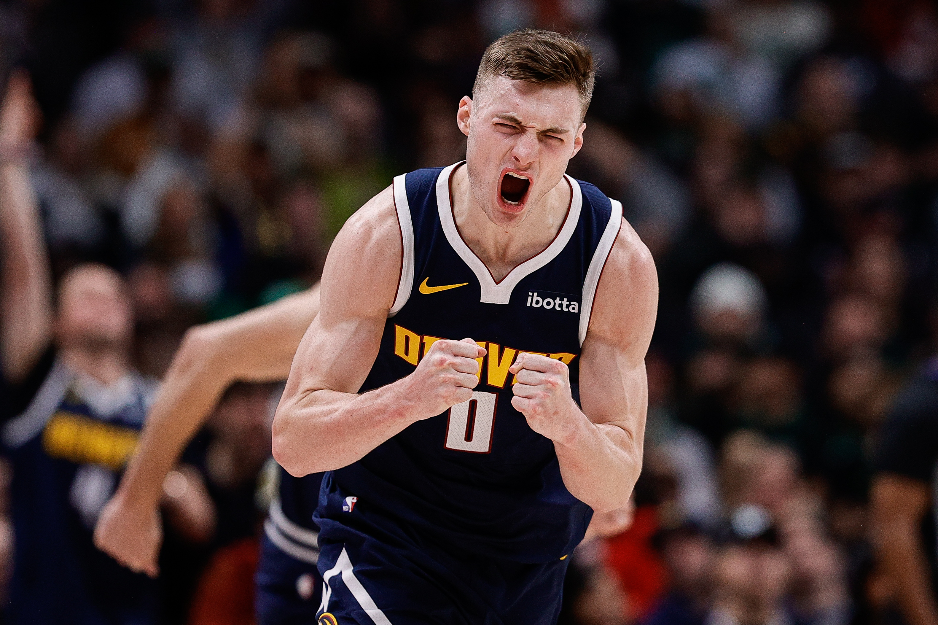Jan 7, 2025; Denver, Colorado, USA; Denver Nuggets guard Christian Braun (0) reacts after a play in the third quarter against the Boston Celtics at Ball Arena. Mandatory Credit: Isaiah J. Downing-Imagn Images