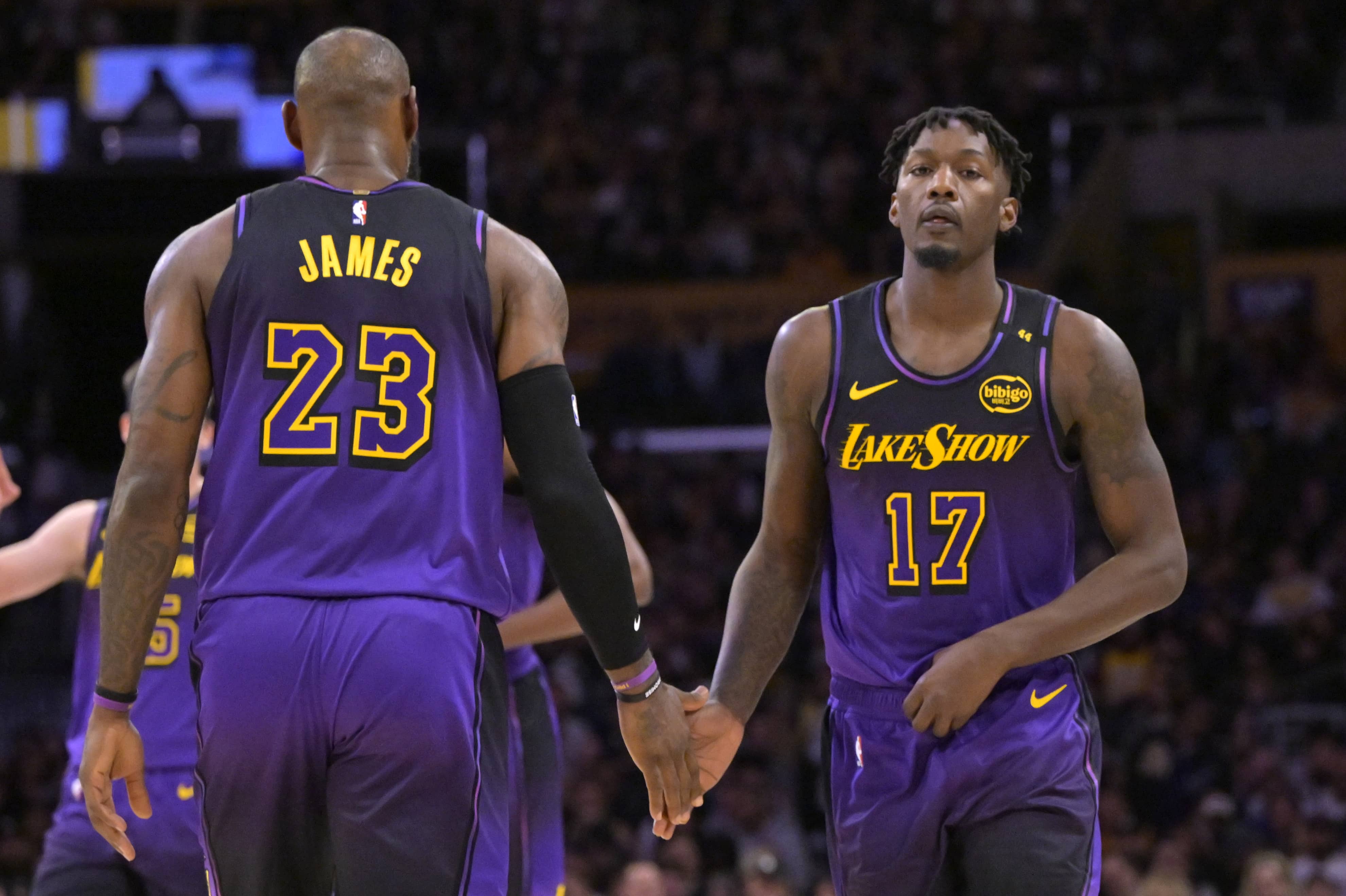 Los Angeles, California, USA; Los Angeles Lakers forward Dorian Finney-Smith (17) subs into the game for forward LeBron James (23) in the first half against the Portland Trail Blazers at Crypto.com Arena. Mandatory Credit: Jayne Kamin-Oncea-Imagn Images
