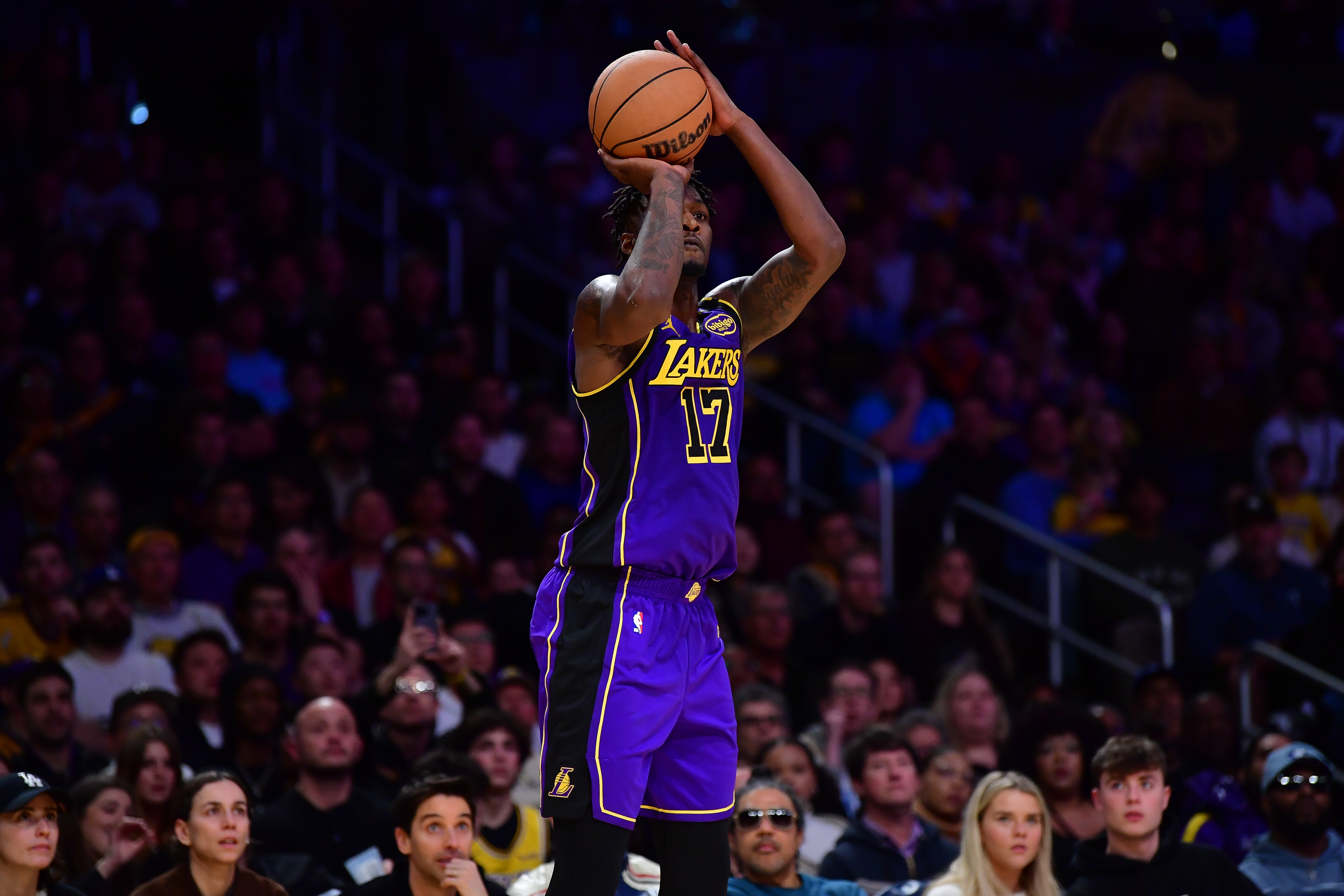 Jan 3, 2025; Los Angeles, California, USA; Los Angeles Lakers forward Dorian Finney-Smith (17) shoots against the Atlanta Hawks during the second half at Crypto.com Arena. Mandatory Credit: Gary A. Vasquez-Imagn Images