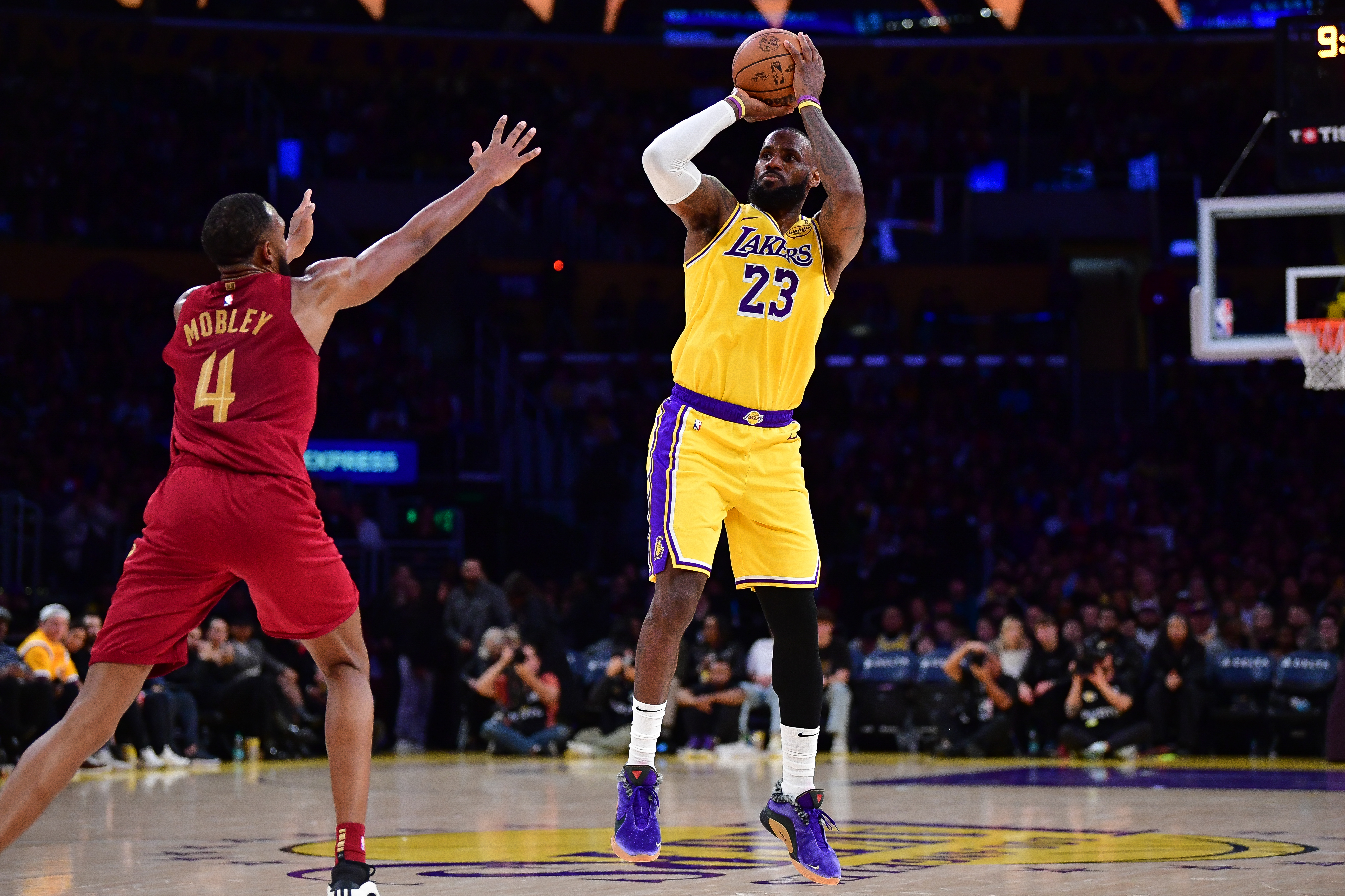 Dec 31, 2024; Los Angeles, California, USA; Los Angeles Lakers forward LeBron James (23) shoots against Cleveland Cavaliers Cleveland Cavaliers forward Evan Mobley (4) during the first half at Crypto.com Arena. Mandatory Credit: Gary A. Vasquez-Imagn Images  