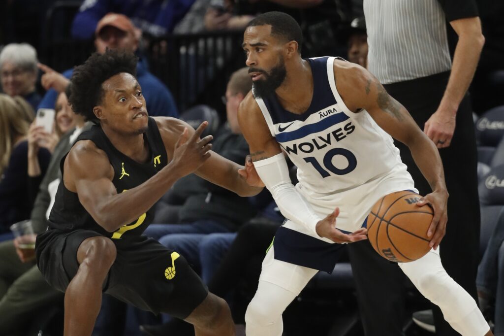 Utah Jazz guard Collin Sexton defends against the Minnesota Timberwolves guard Mike Conley