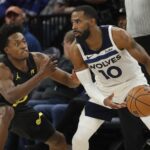 Utah Jazz guard Collin Sexton defends against the Minnesota Timberwolves guard Mike Conley