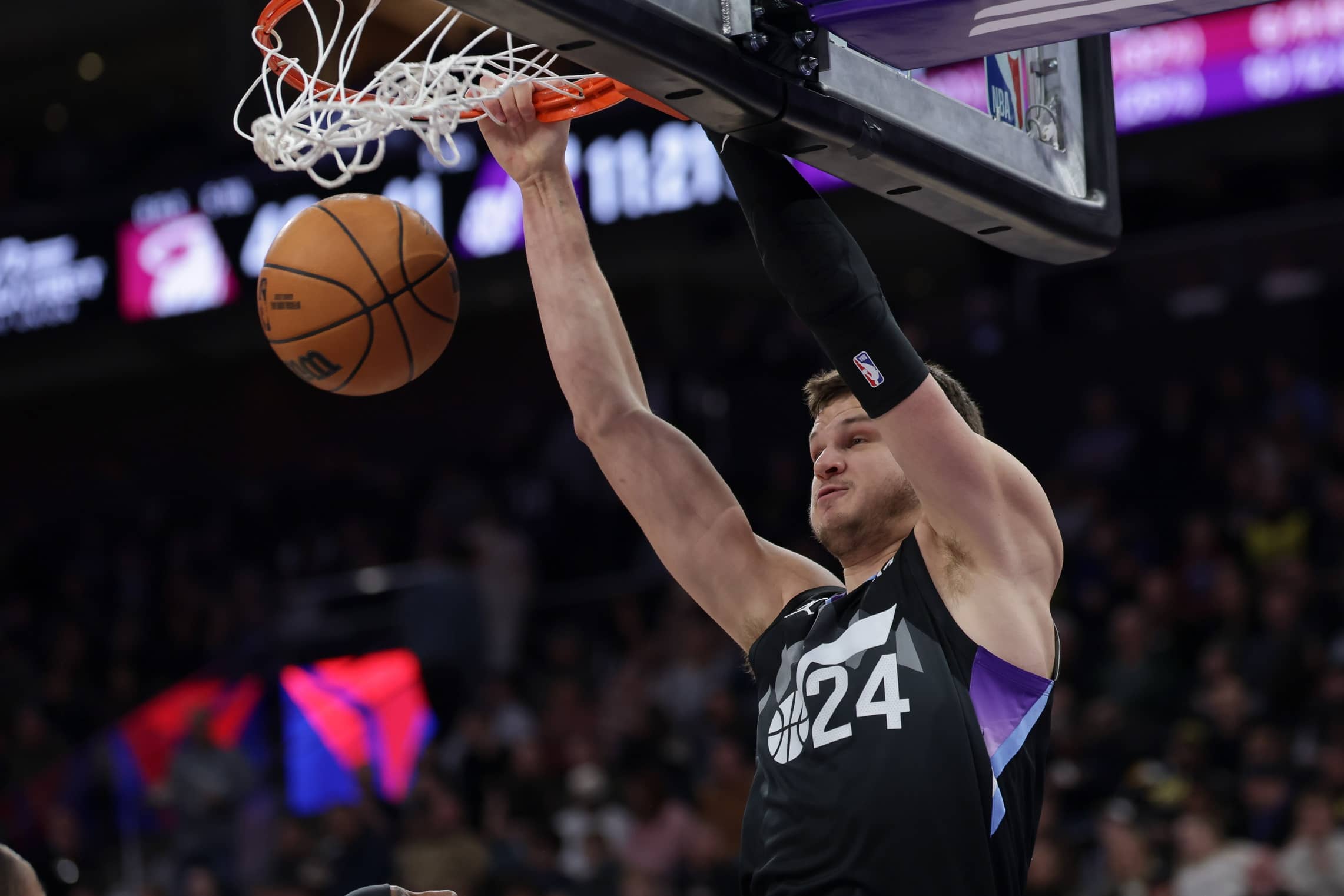 Jan 9, 2025; Salt Lake City, Utah, USA; Utah Jazz center Walker Kessler (24) dunks the ball against the Miami Heat during the second half at Delta Center. Mandatory Credit: Chris Nicoll-Imagn Images