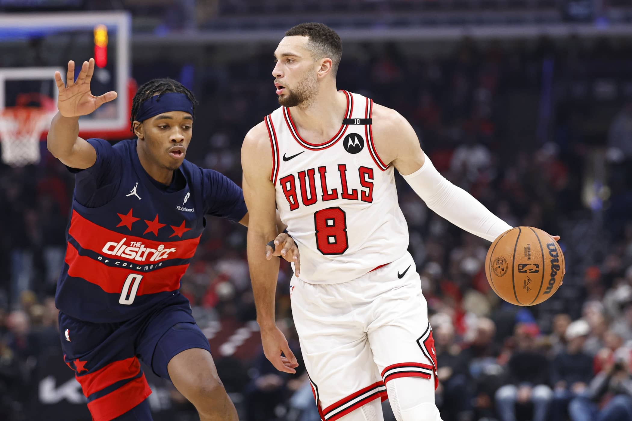 Jan 10, 2025; Chicago, Illinois, USA; Chicago Bulls guard Zach LaVine (8) drives to the basket against Washington Wizards guard Bilal Coulibaly (0) during the first half at United Center. Mandatory Credit: Kamil Krzaczynski-Imagn Images