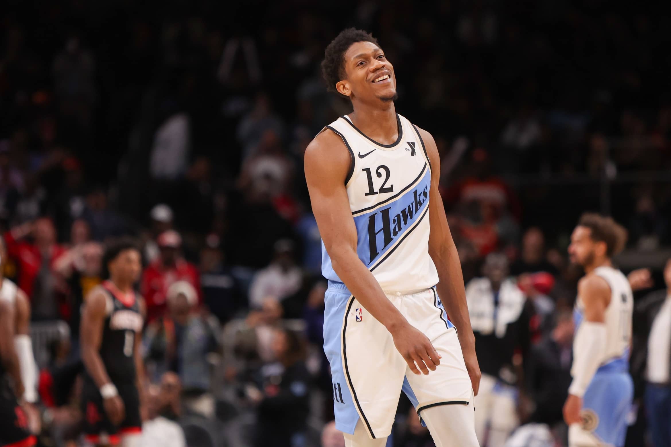 Atlanta Hawks forward De'Andre Hunter (12) reacts after a missed shot against the Houston Rockets in the fourth quarter at State Farm Arena.