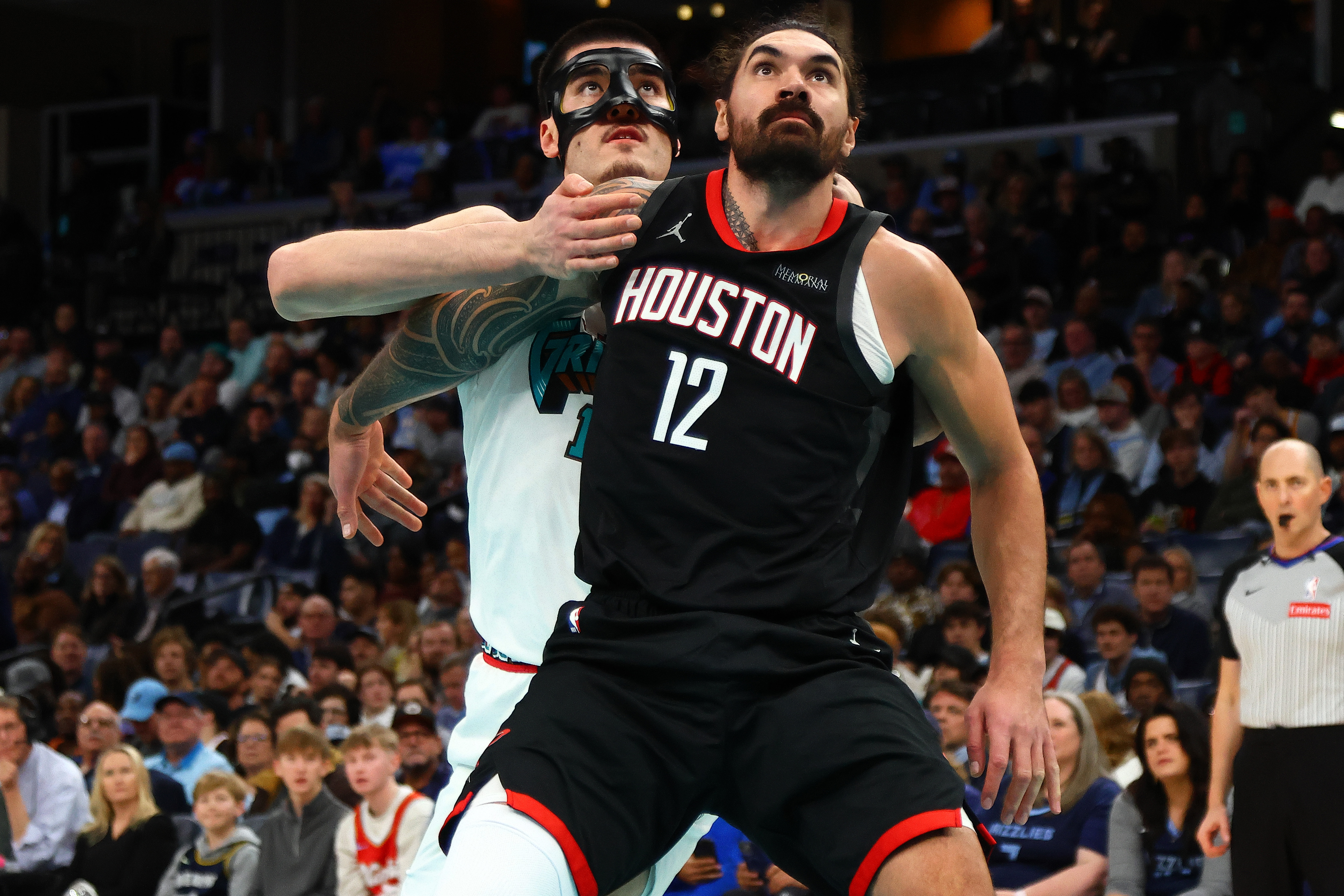 Jan 30, 2025; Memphis, Tennessee, USA; Houston Rockets center Steven Adams (12) boxes out Memphis Grizzlies center Zach Edey (14) during the second quarter at FedExForum. Mandatory Credit: Petre Thomas-Imagn Images  