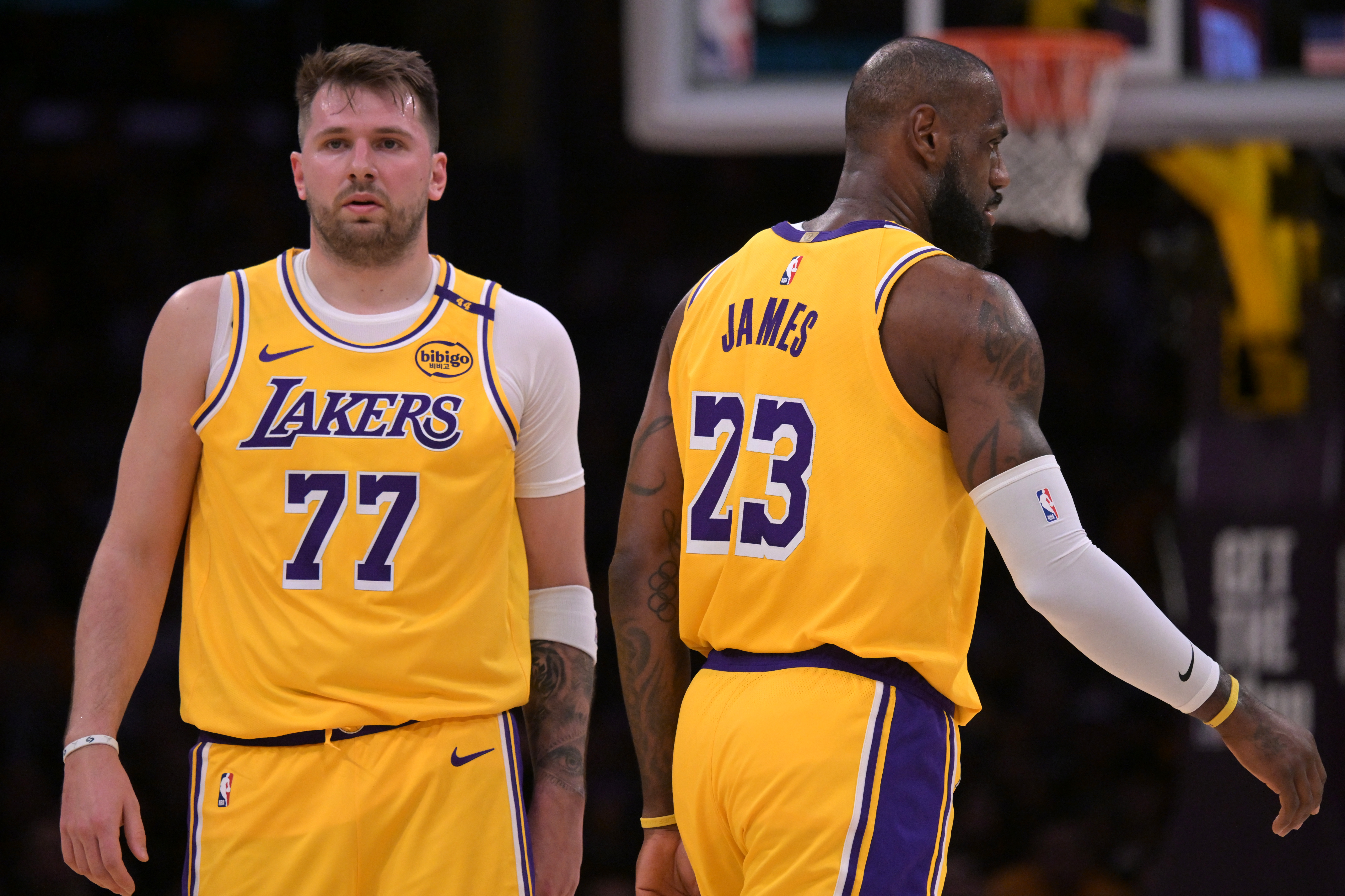 Feb 10, 2025; Los Angeles, California, USA; Los Angeles Lakers guard Luka Doncic (77) and forward LeBron James (23) on the court in the first half against the Utah Jazz at Crypto.com Arena. Mandatory Credit: Jayne Kamin-Oncea-Imagn Images