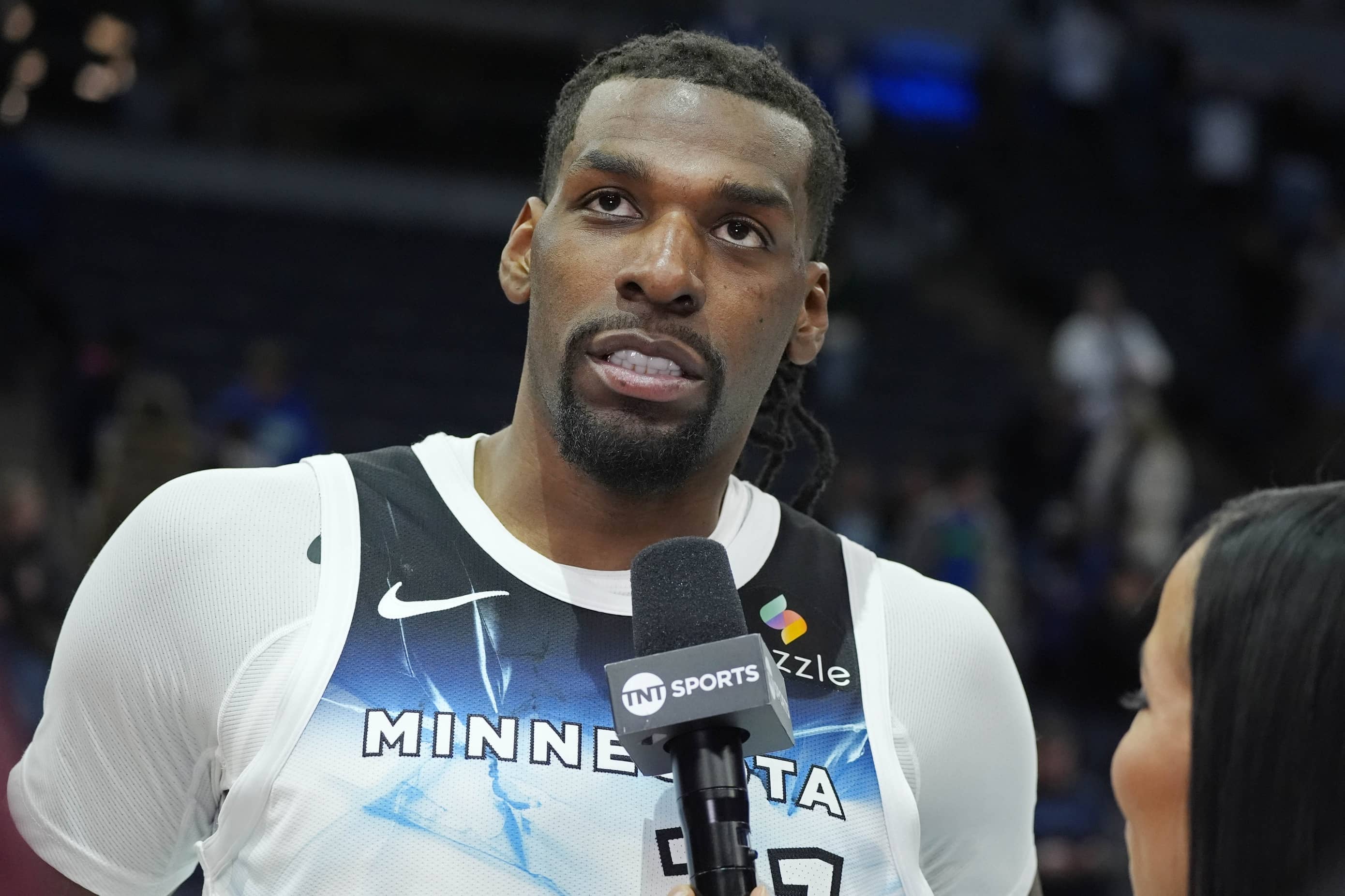 Feb 13, 2025; Minneapolis, Minnesota, USA; Minnesota Timberwolves center Naz Reid (11) takes part in an interview after defeating the Oklahoma City Thunder at Target Center. Mandatory Credit: Bruce Kluckhohn-Imagn Images