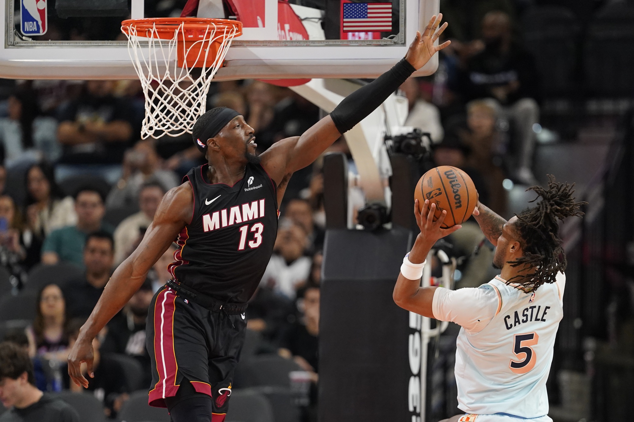 San Antonio Spurs guard Stephon Castle (5) shoots over Miami Heat center Bam Adebayo (13) during the second half at Frost Bank Center. Mandatory Credit: Scott Wachter-Imagn Images