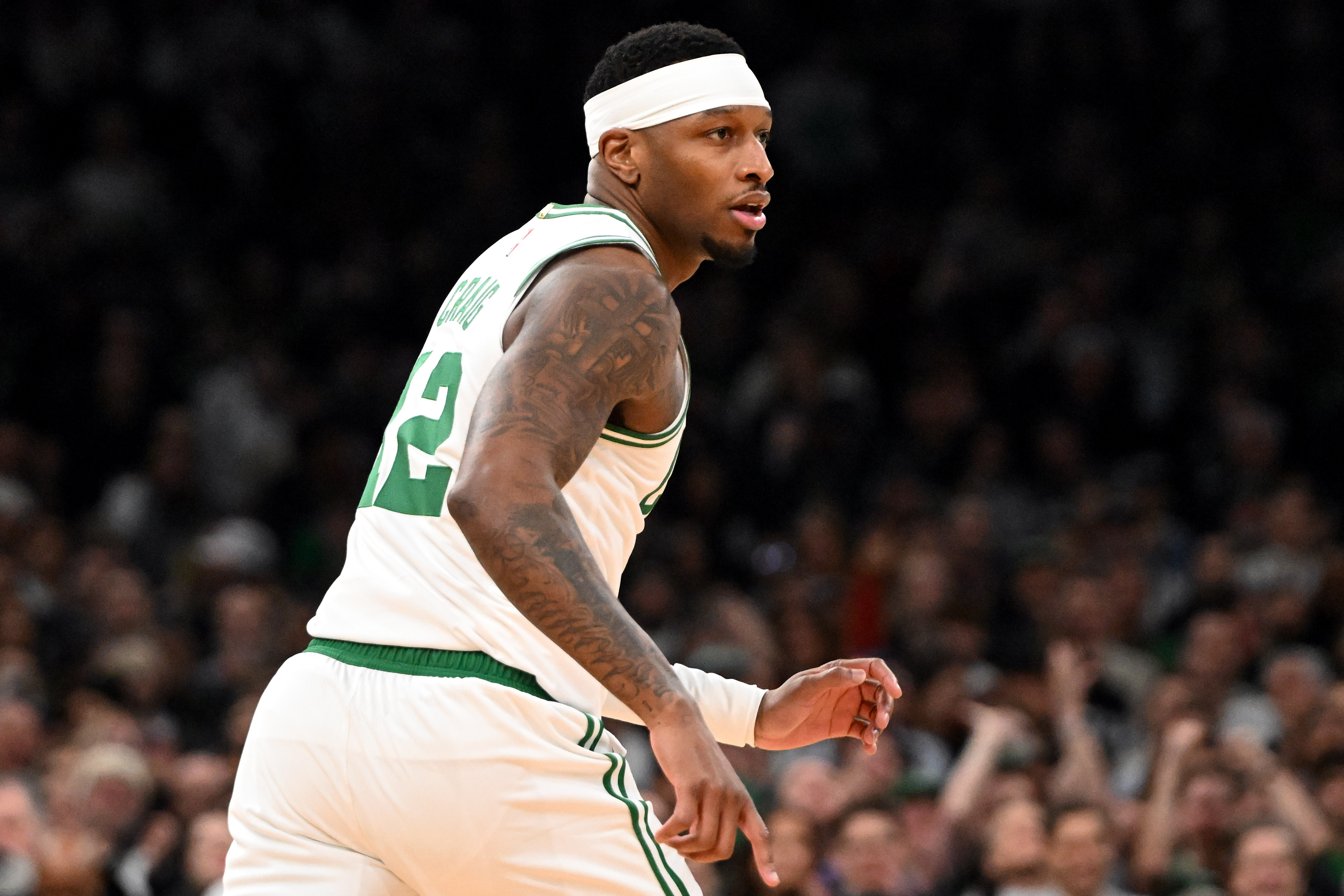 Feb 12, 2025; Boston, Massachusetts, USA; Boston Celtics forward Torrey Craig (12) runs up the court during the second quarter of a game against the San Antonio Spurs at the TD Garden. Mandatory Credit: Brian Fluharty-Imagn Images
