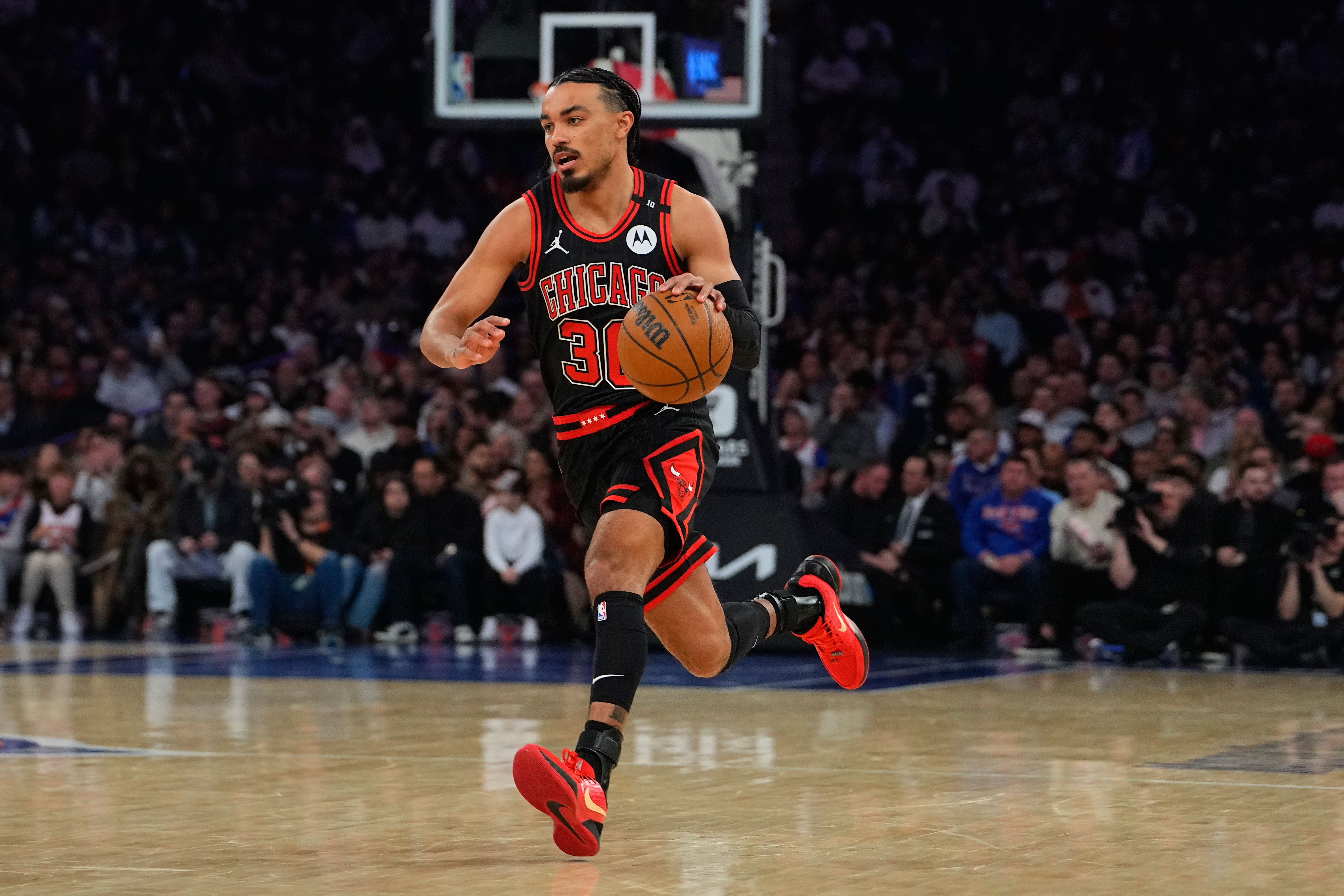 Feb 20, 2025; New York, New York, USA; Chicago Bulls point guard Tre Jones (30) dribbles the ball against the New York Knicks during the first half at Madison Square Garden. Mandatory Credit: Gregory Fisher-Imagn Images