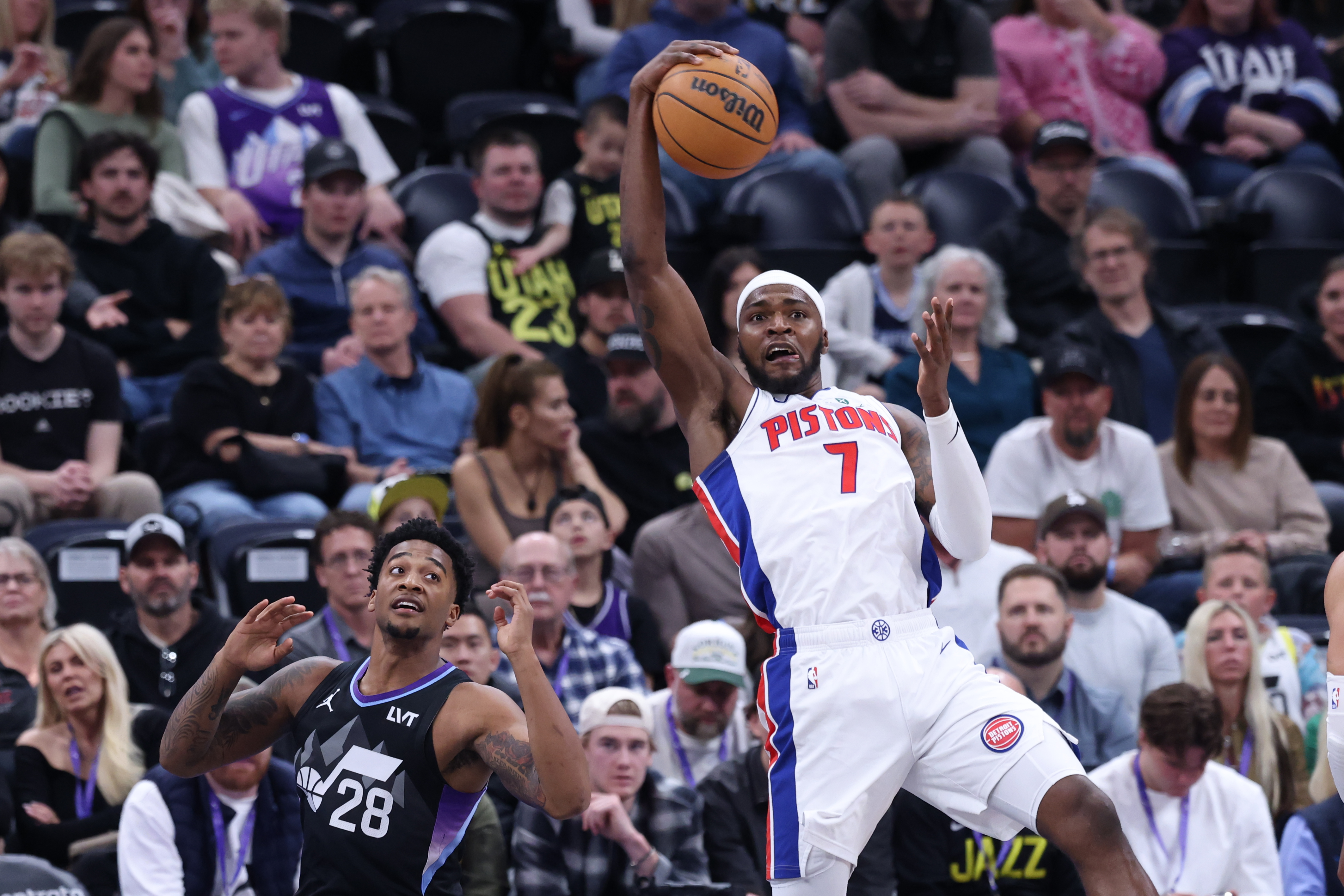 Mar 3, 2025; Salt Lake City, Utah, USA; Detroit Pistons forward Paul Reed (7) steals a pass intended for Utah Jazz forward Brice Sensabaugh (28) during the first half at Delta Center. Mandatory Credit: Rob Gray-Imagn Images