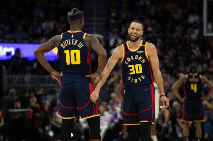 Golden State Warriors forward Jimmy Butler III (10) and guard Stephen Curry (30) share a laugh during the second quarter against the Sacramento Kings at Chase Center