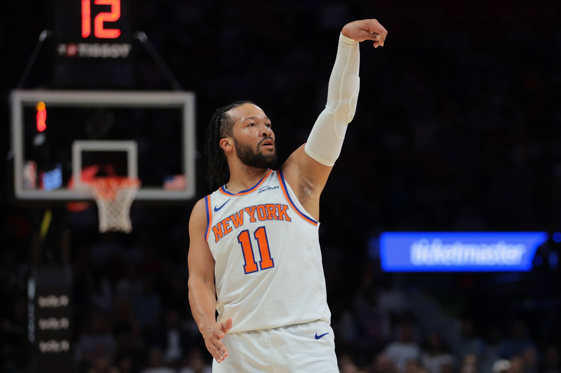 New York Knicks guard Jalen Brunson (11) watches his shot against the Miami Heat during the first quarter at Kaseya Center.