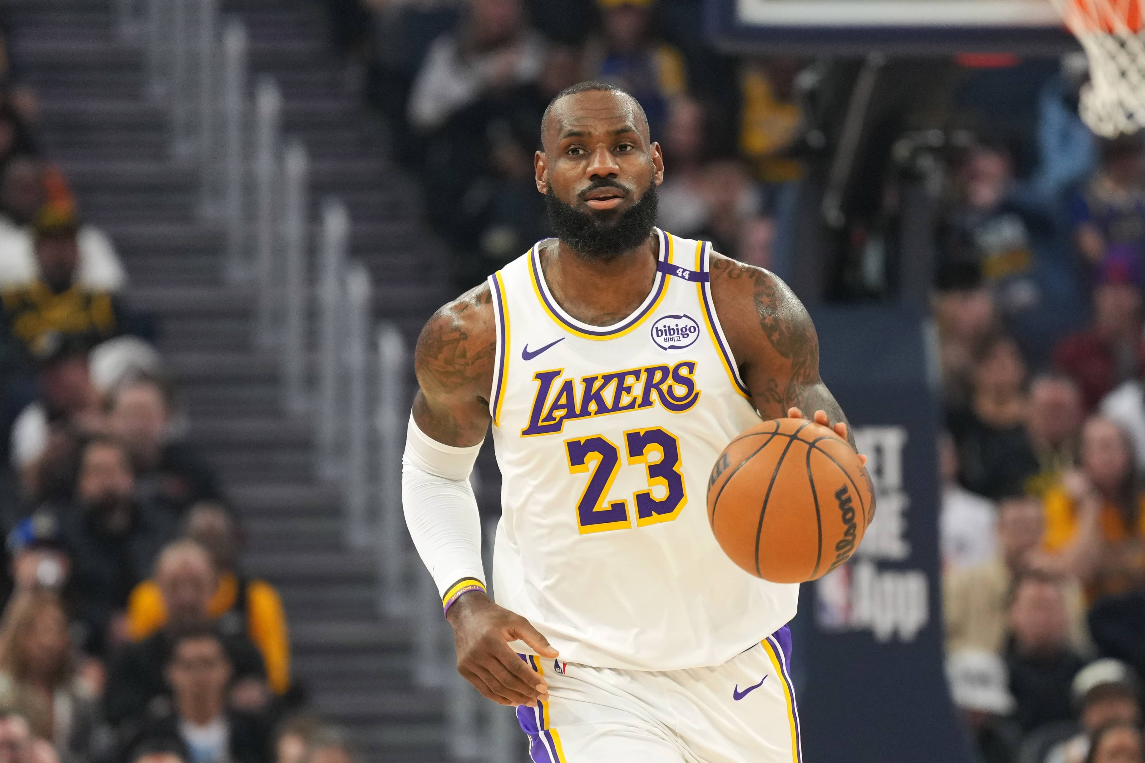 San Francisco, California, USA; Los Angeles Lakers forward LeBron James (23) dribbles against the Golden State Warriors during the first quarter at Chase Center. Mandatory Credit: Darren Yamashita-Imagn Images