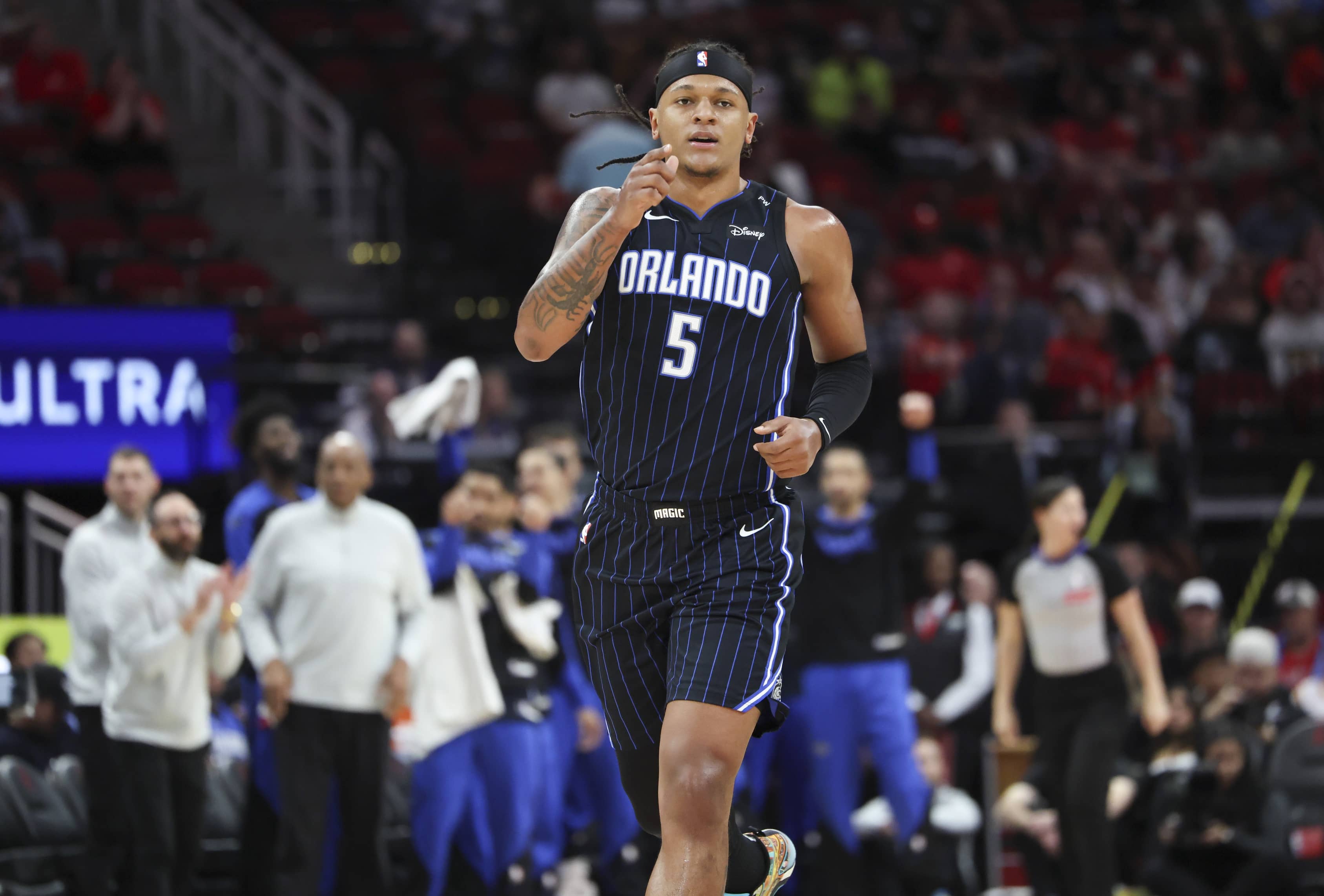 Mar 10, 2025; Houston, Texas, USA; Orlando Magic forward Paolo Banchero (5) reacts after scoring a basket during the first quarter against the Houston Rockets at Toyota Center. Mandatory Credit- Troy Taormina-Imagn Images