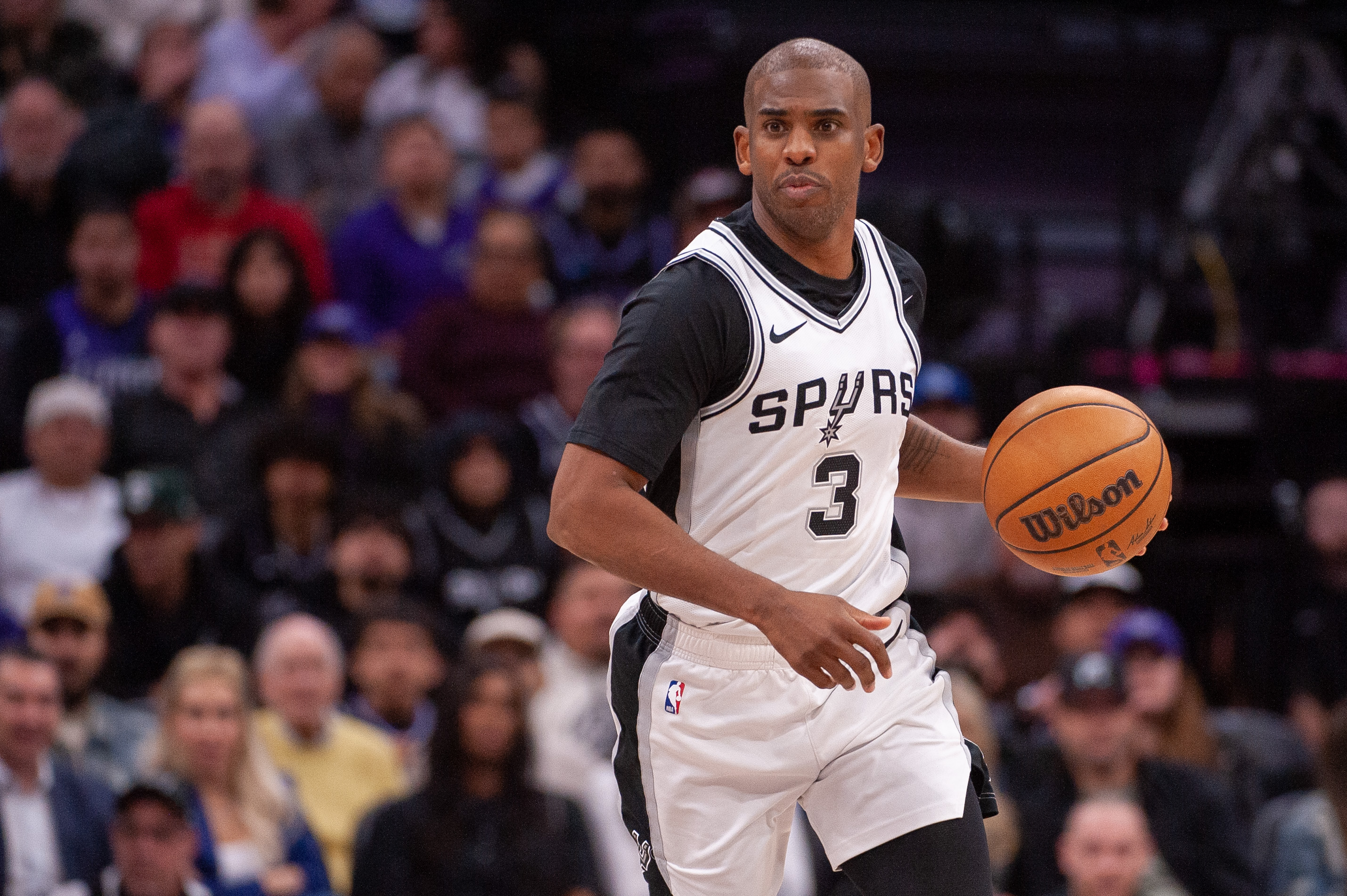 Mar 7, 2025; Sacramento, California, USA; San Antonio Spurs guard Chris Paul (3) controls the ball against the Sacramento Kings during the fourth quarter at Golden 1 Center. Mandatory Credit: Ed Szczepanski-Imagn Images