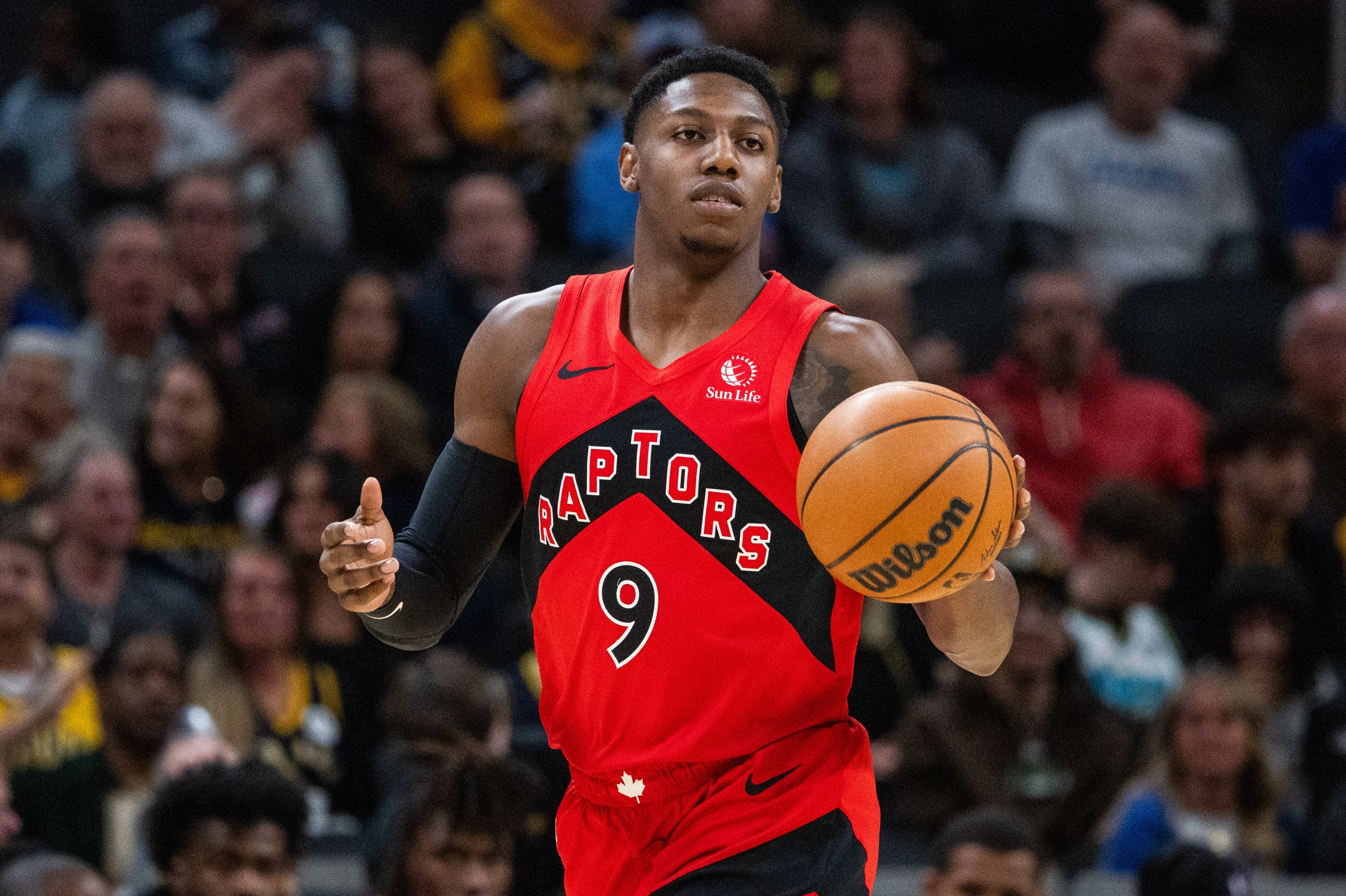 Toronto Raptors guard RJ Barrett (9) dribbles the ball in the first half against the Indiana Pacers at Gainbridge Fieldhouse. Mandatory Credit: Trevor Ruszkowski-Imagn Images