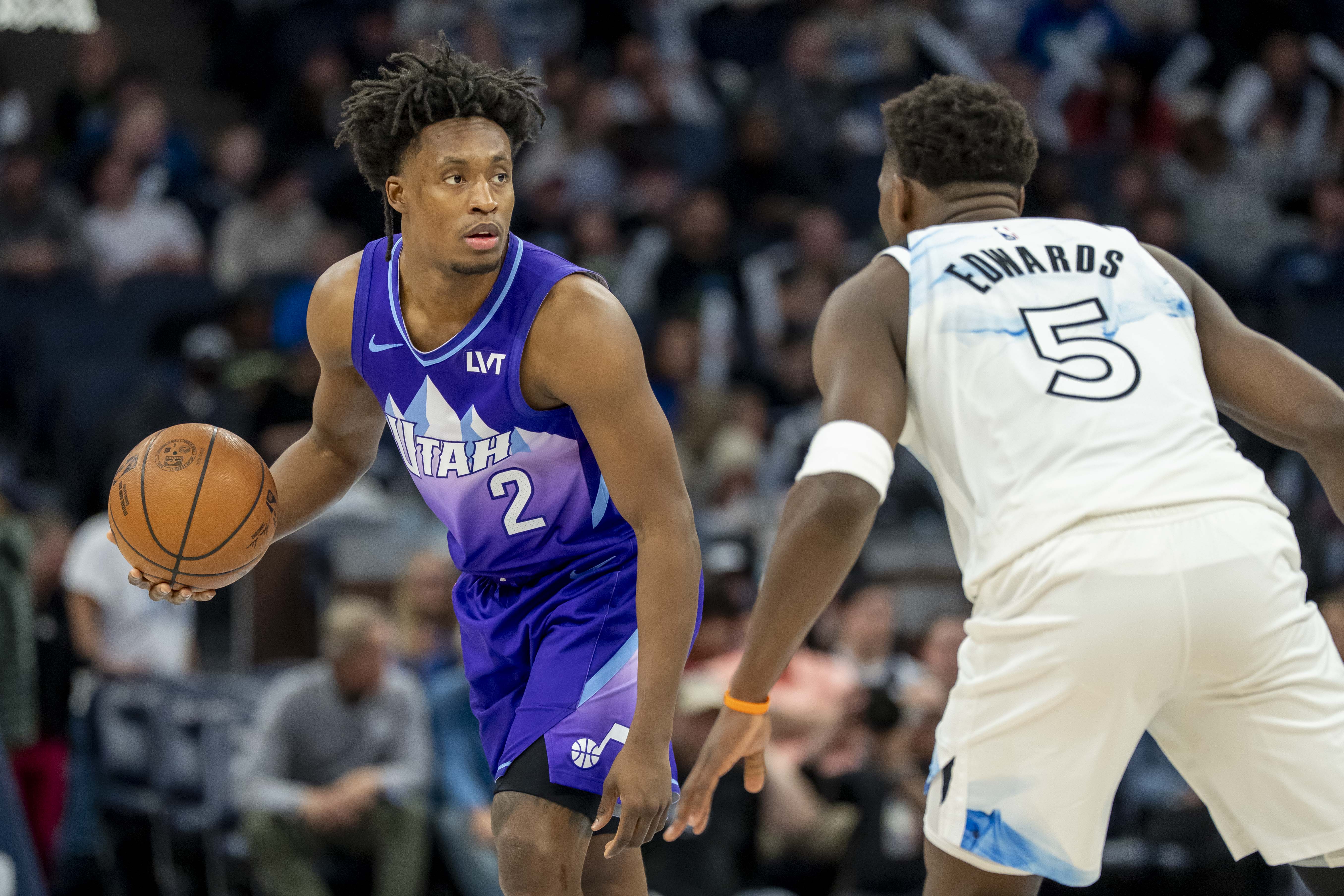 Mar 16, 2025; Minneapolis, Minnesota, USA; Utah Jazz guard Collin Sexton (2) dribbles the ball as Minnesota Timberwolves guard Anthony Edwards (5) plays defense in the second half at Target Center. Mandatory Credit: Jesse Johnson-Imagn Images