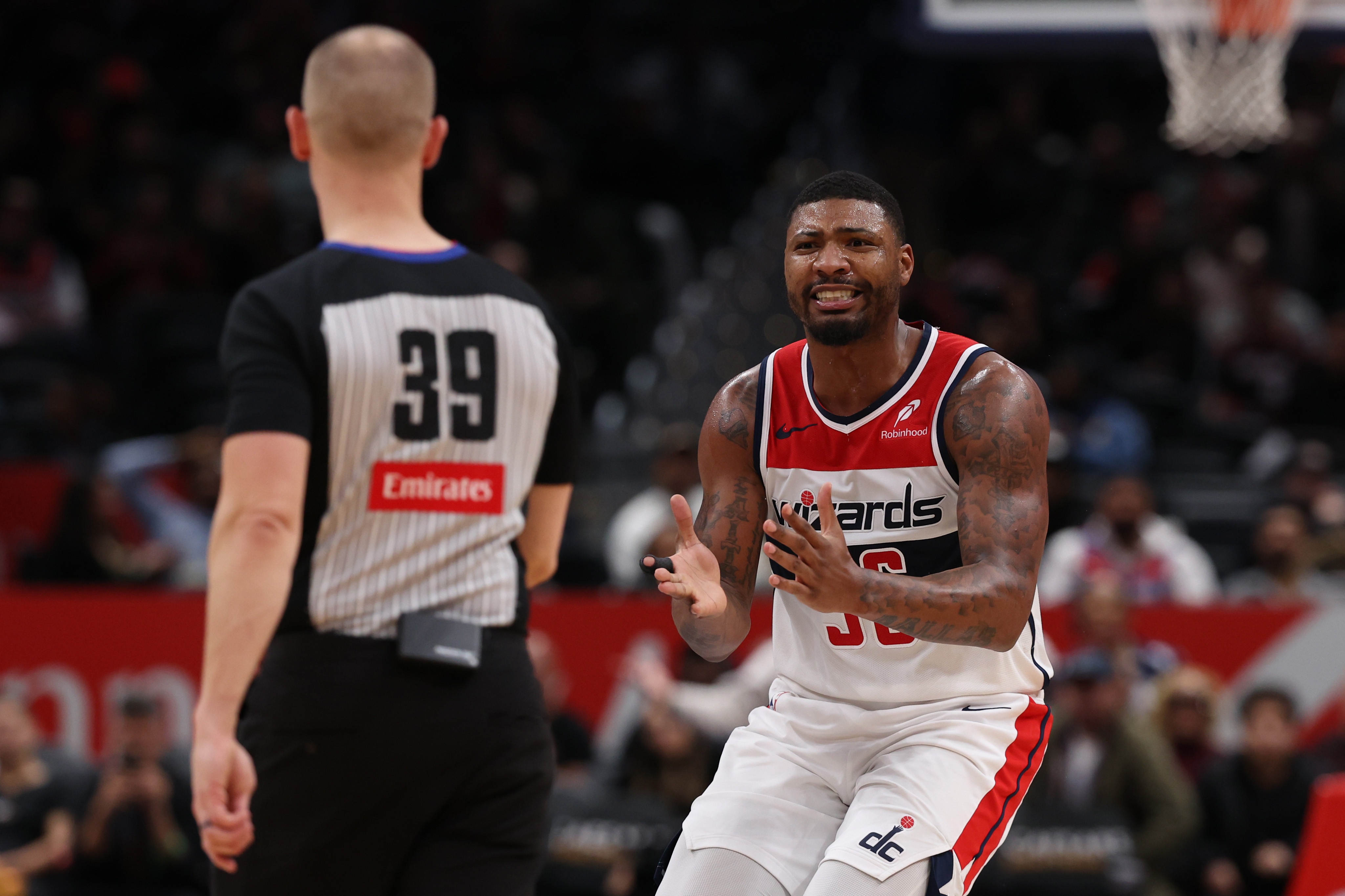 Feb 26, 2025; Washington, District of Columbia, USA; Washington Wizards guard Marcus Smart (36) reacts after being whistled for a technical foul by referee Tyler Ford (39) against the Portland Trail Blazers late in the second half at Capital One Arena. Mandatory Credit: Geoff Burke-Imagn Images  