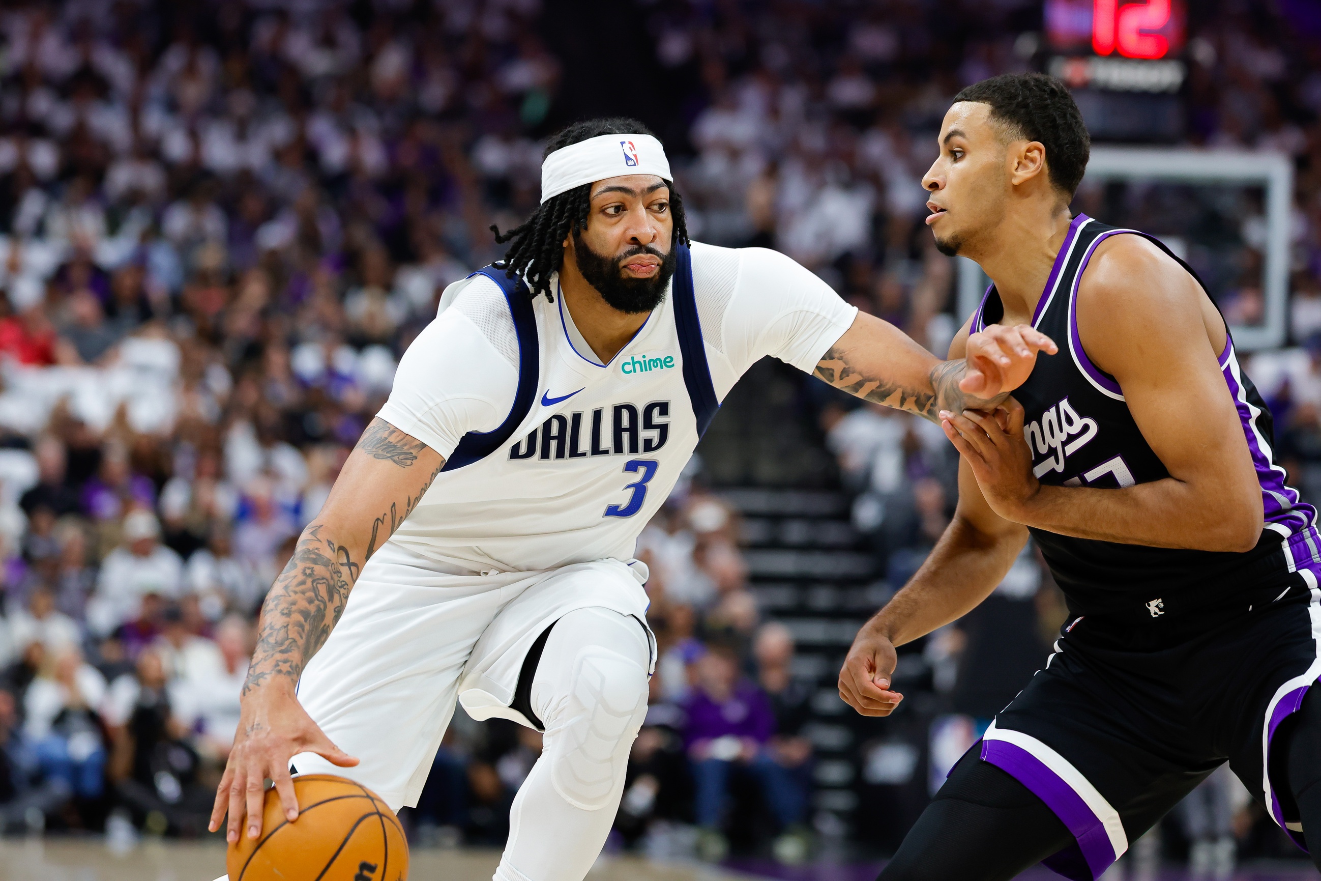 Dallas Mavericks forward Anthony Davis (3) dribbles the ball against Sacramento Kings forward Keegan Murray (13) during the first quarter at Golden 1 Center. Mandatory Credit: Sergio Estrada-Imagn Images