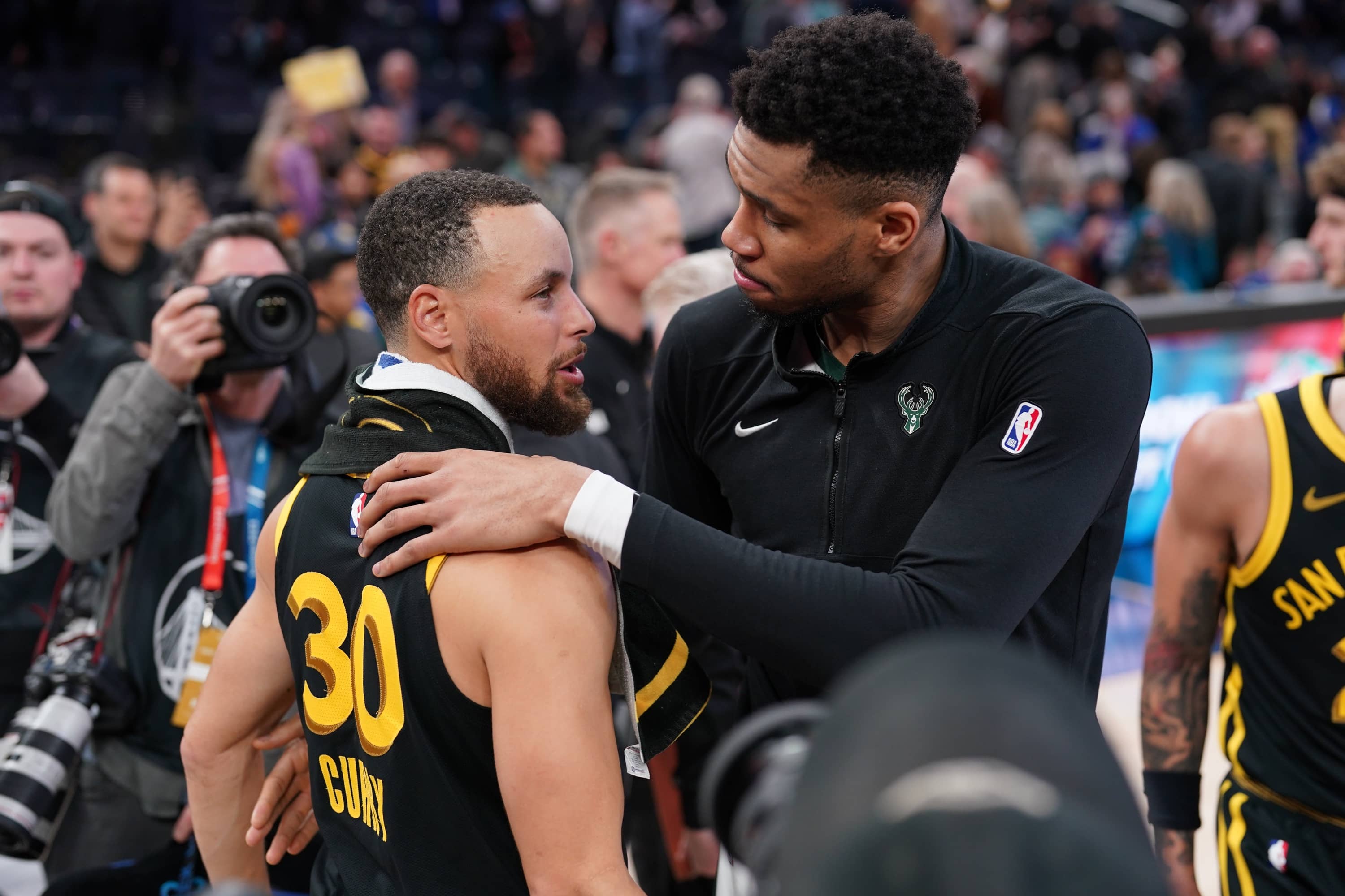 Mar 6, 2024; San Francisco, California, USA; Milwaukee Bucks forward Giannis Antetokounmpo (34) and Golden State Warriors guard Stephen Curry (30) meet after the game at the Chase Center.