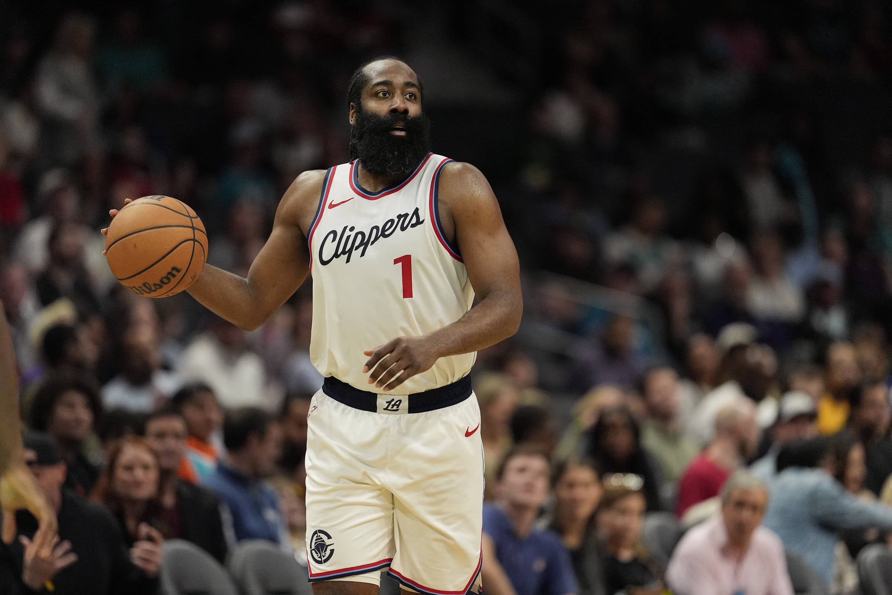 Jan 31, 2025; Charlotte, North Carolina, USA; LA Clippers guard James Harden (1) handles the ball against the Charlotte Hornets during the second half at Spectrum Center. Mandatory Credit: Jim Dedmon-Imagn Images