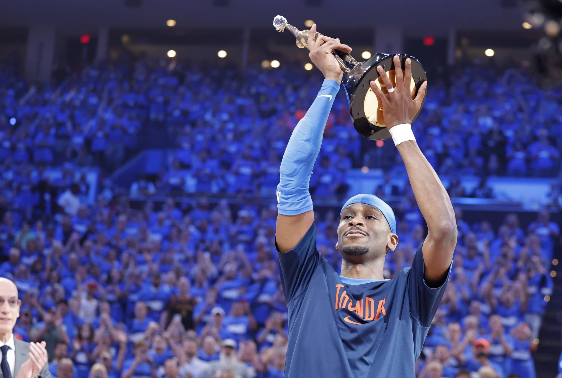 May 22, 2025; Oklahoma City, Oklahoma, USA; NBA commissioner is Adam Silver presents Oklahoma City Thunder guard Shai Gilgeous-Alexander (2) with the Michael Jordan Trophy for winning the most valuable player award for the 2024-25 season before game two of the western conference finals for the 2025 NBA Playoffs at Paycom Center.