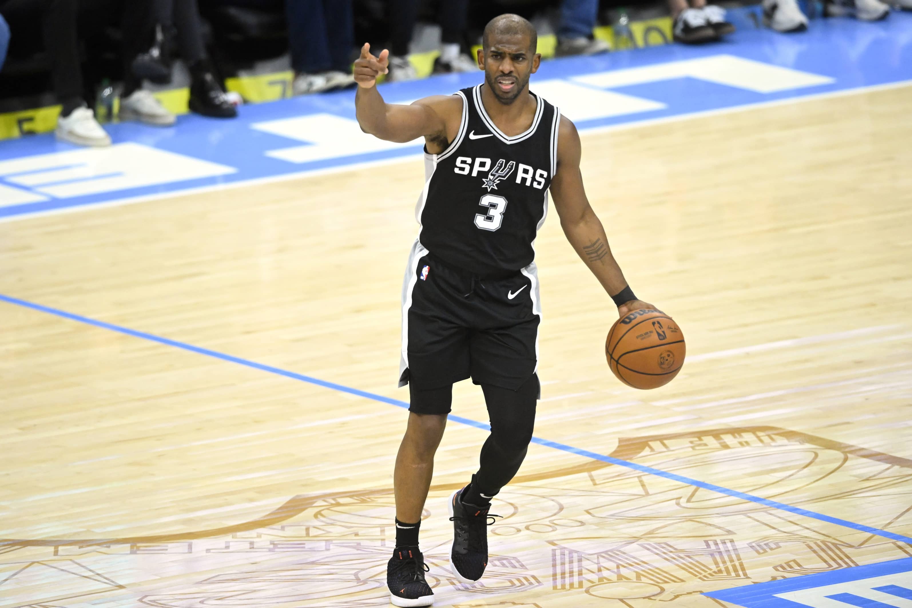 Mar 27, 2025; Cleveland, Ohio, USA; San Antonio Spurs guard Chris Paul (3) dribbles in the third quarter against the Cleveland Cavaliers at Rocket Arena. Mandatory Credit: David Richard-Imagn Images