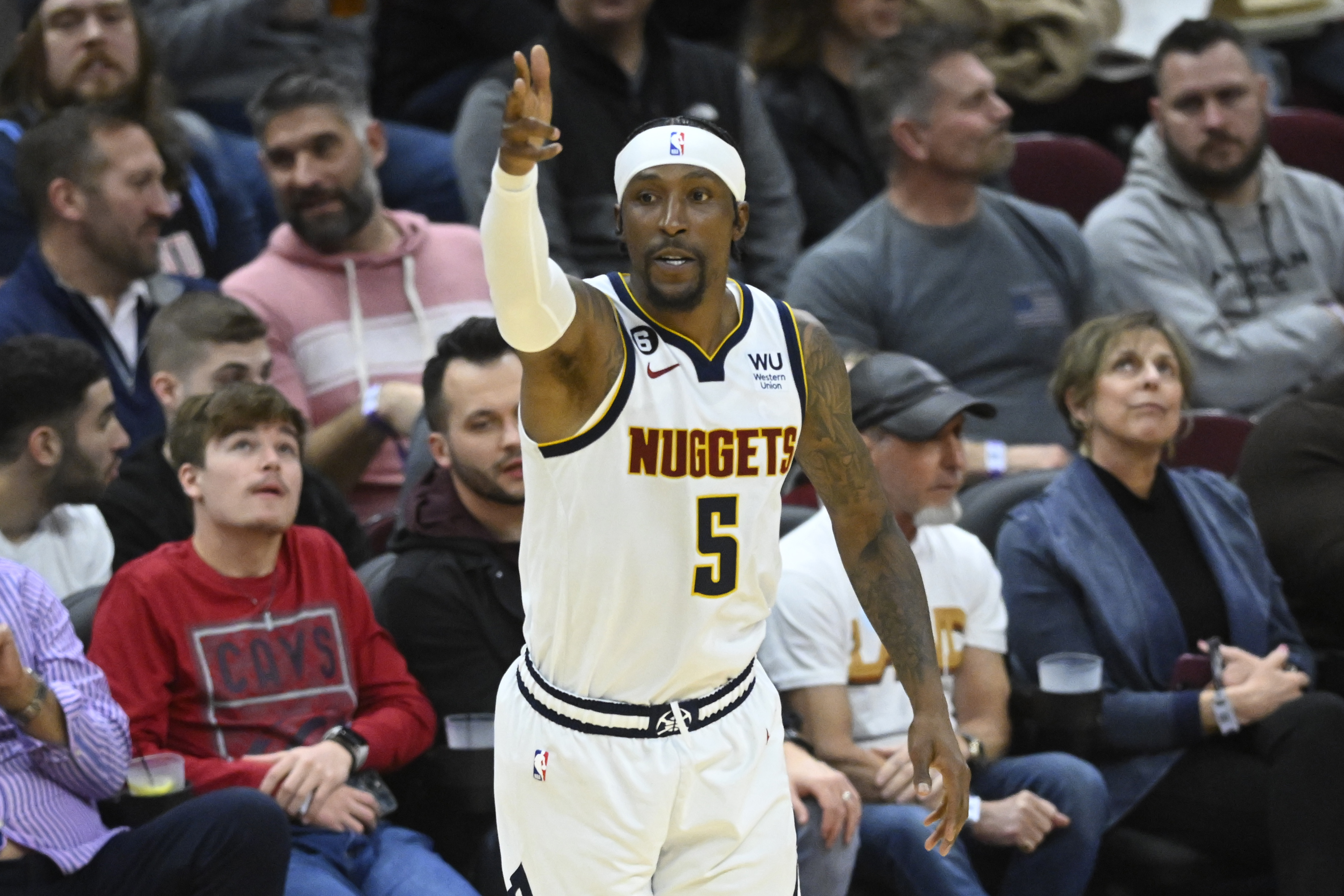 Feb 23, 2023; Cleveland, Ohio, USA; Denver Nuggets guard Kentavious Caldwell-Pope (5) celebrates his three-point basket in the fourth quarter against the Cleveland Cavaliers at Rocket Mortgage FieldHouse. Mandatory Credit: David Richard-Imagn Images  