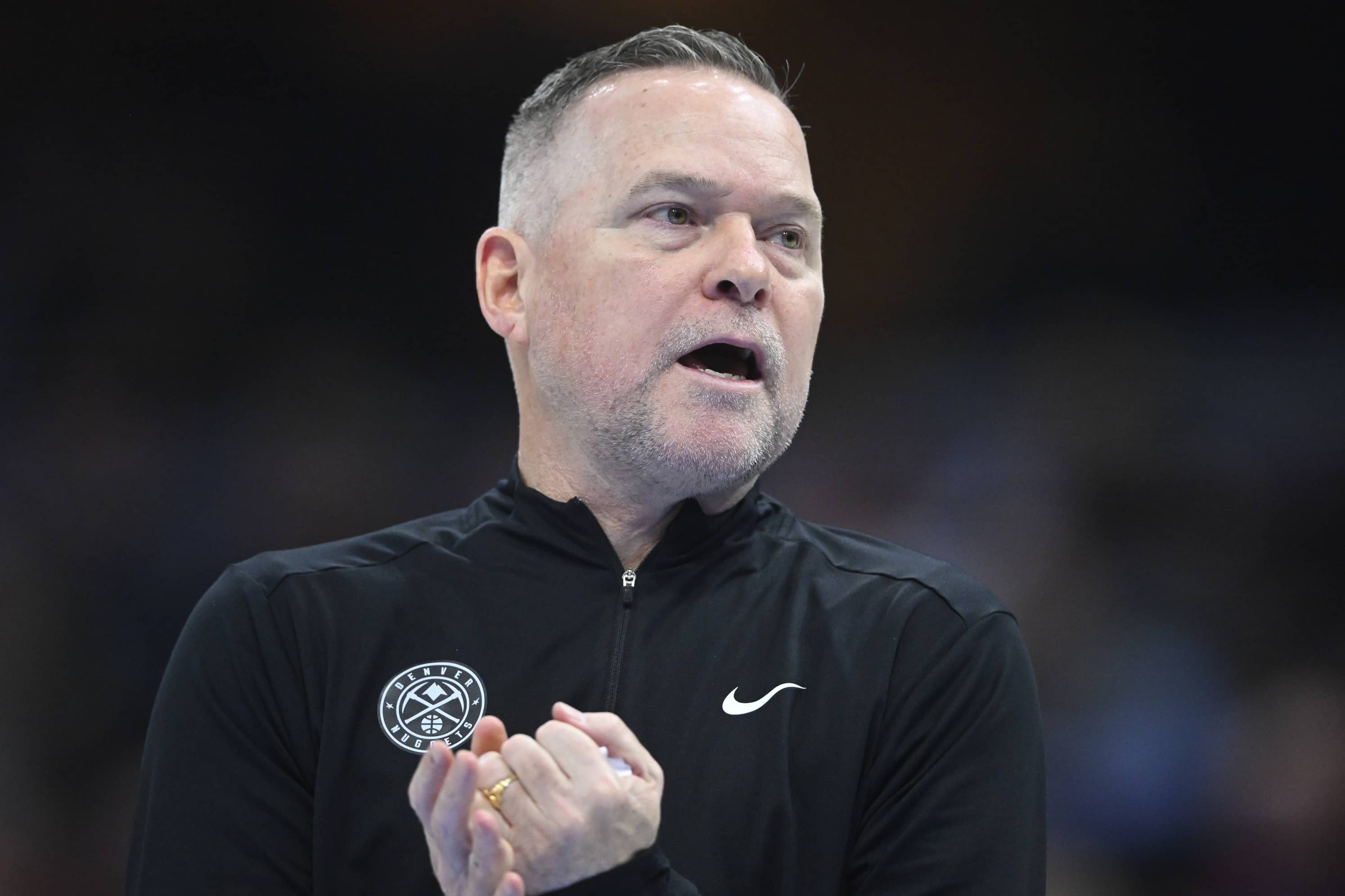 Denver Nuggets head coach Michael Malone walks on the court in the second quarter against the Cleveland Cavaliers at Rocket Mortgage FieldHouse.