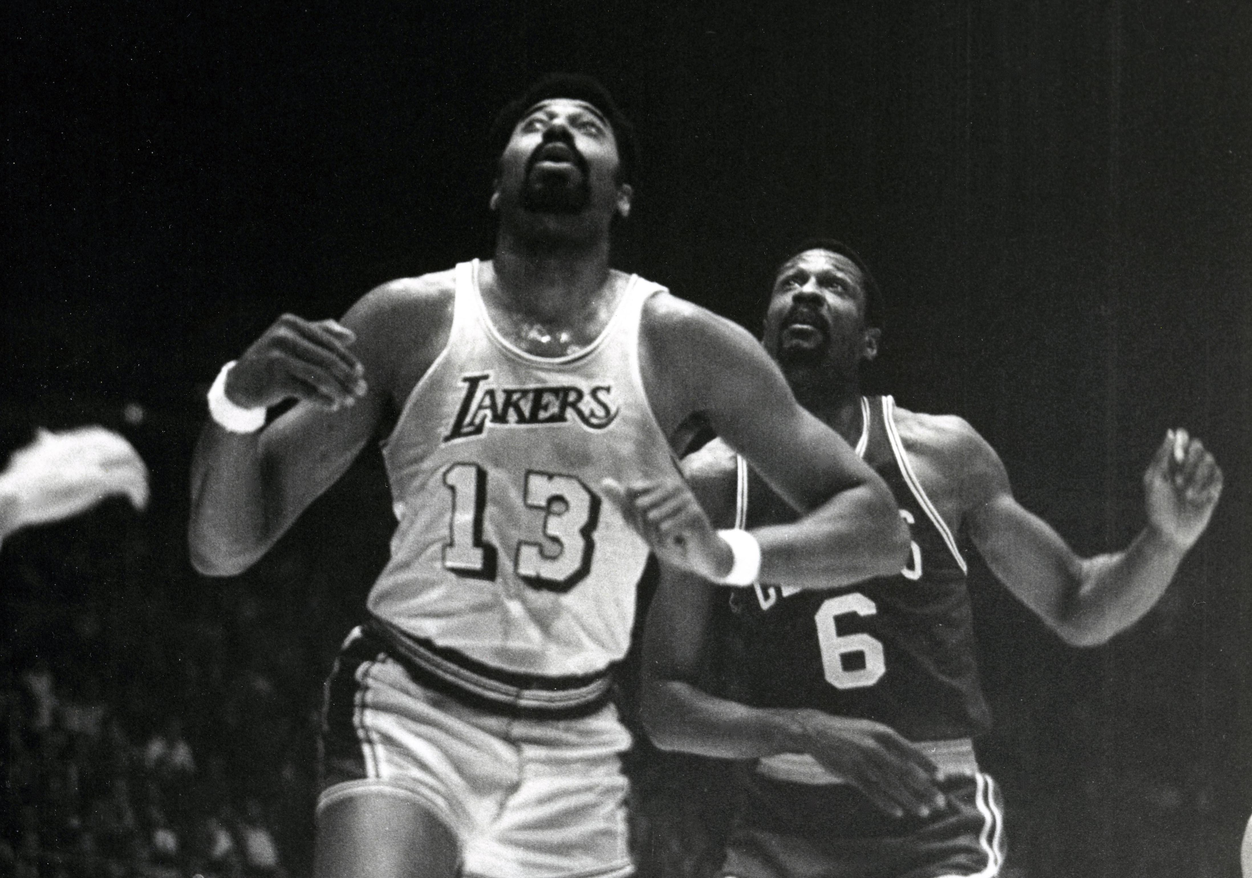 Unknown date; Los Angeles, CA, USA; FILE PHOTO; Los Angeles Lakers center Wilt Chamberlain (13) battles for a rebound in front of Boston Celtics center Bill Russell (6) at the Forum. Mandatory Credit: Darryl Norenberg-Imagn Images