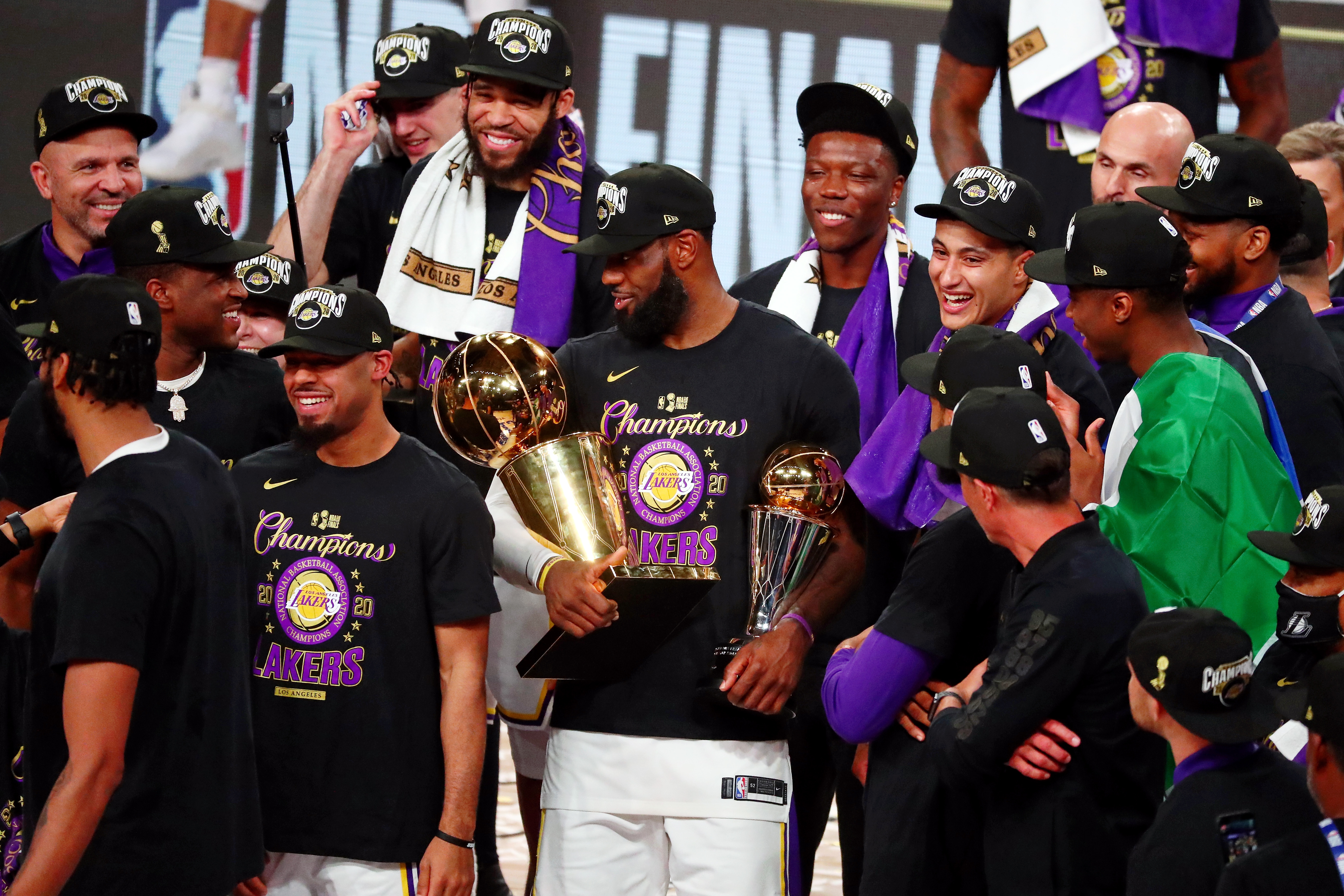 Oct 11, 2020; Lake Buena Vista, Florida, USA; Los Angeles Lakers forward LeBron James (23) holds up the MVP and Finals trophies after game six of the 2020 NBA Finals at AdventHealth Arena. The Los Angeles Lakers won 106-93 to win the series. Mandatory Credit: Kim Klement-Imagn Images  