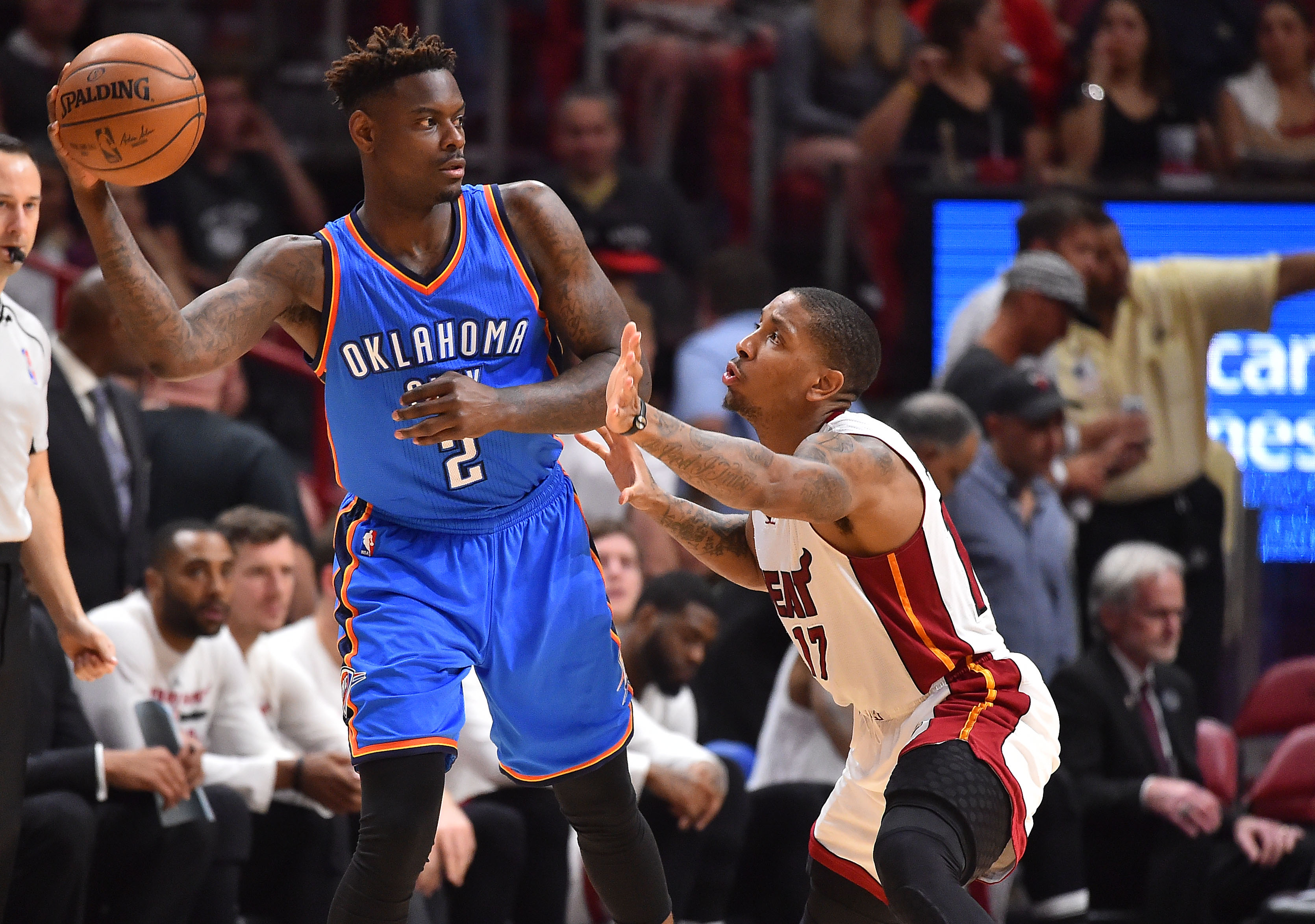 Dec 27, 2016; Miami, FL, USA; Oklahoma City Thunder guard Anthony Morrow (2) passes the ball around the defense of Miami Heat guard Rodney McGruder (17) during the second half at American Airlines Arena. The Oklahoma City Thunder defeat the Miami Heat 106-94. Mandatory Credit: Jasen Vinlove-Imagn Images