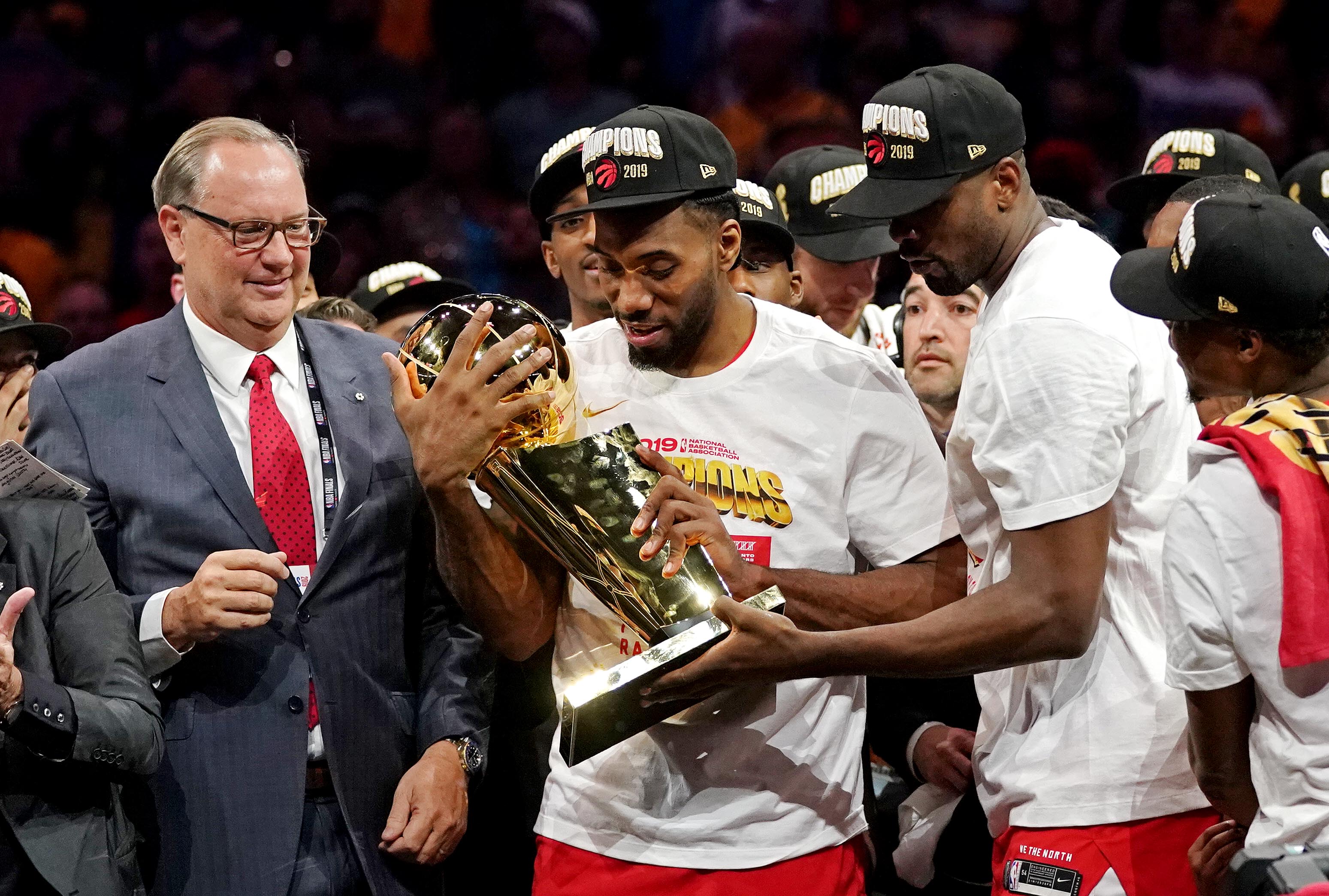 Jun 13, 2019; Oakland, CA, USA; Toronto Raptors forward Kawhi Leonard (2) and Toronto Raptors center Serge Ibaka (9) celebrate with the Larry O'Brien Trophy after the Golden State Warriors in game six of the 2019 NBA Finals at Oracle Arena. Mandatory Credit: Kyle Terada-Imagn Images  