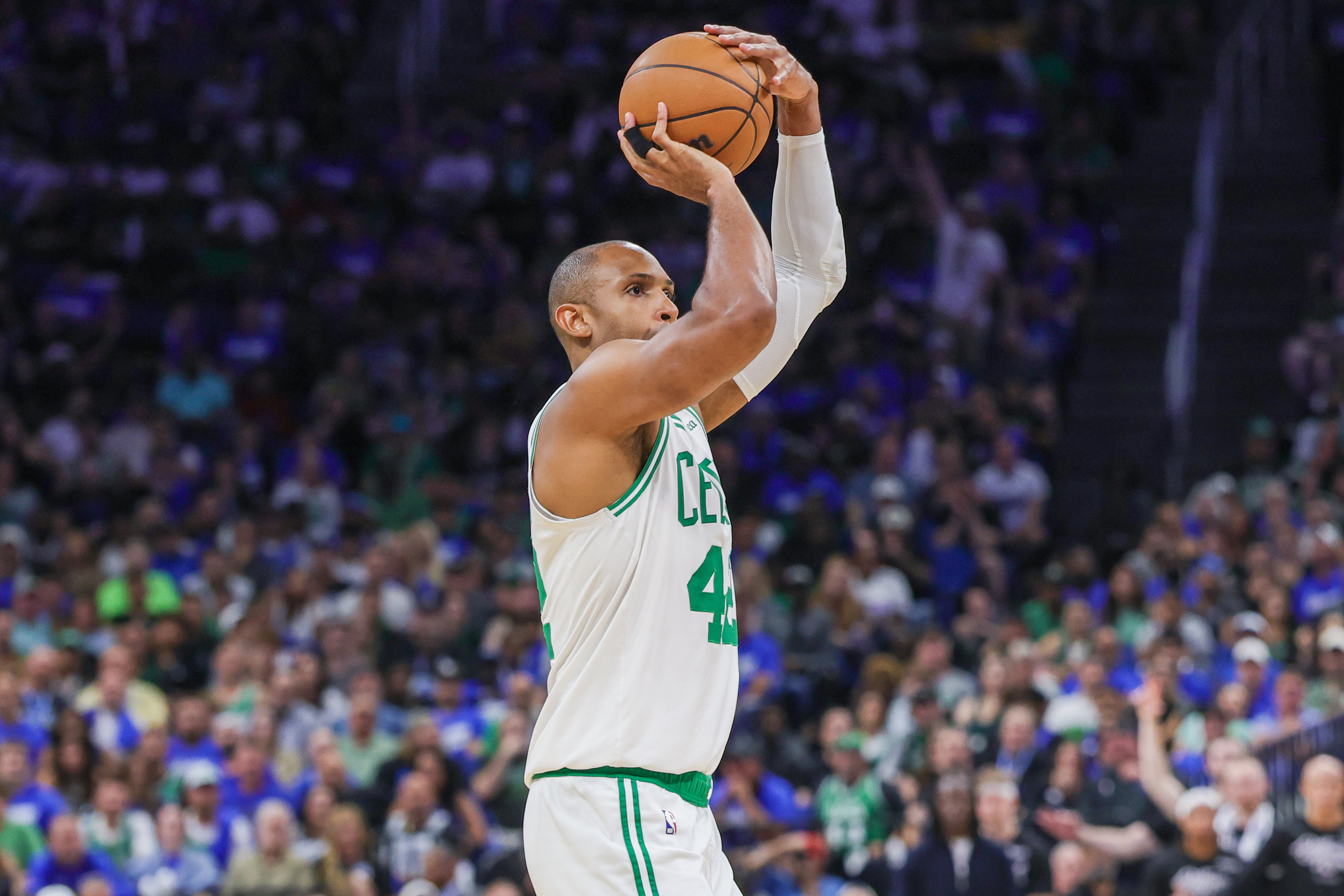 Apr 25, 2025; Orlando, Florida, USA; Boston Celtics center Al Horford (42) shoots a three point basket against the Orlando Magic during the second half of game three of first round for the 2024 NBA Playoffs at Kia Center. Mandatory Credit: Mike Watters-Imagn Images  
