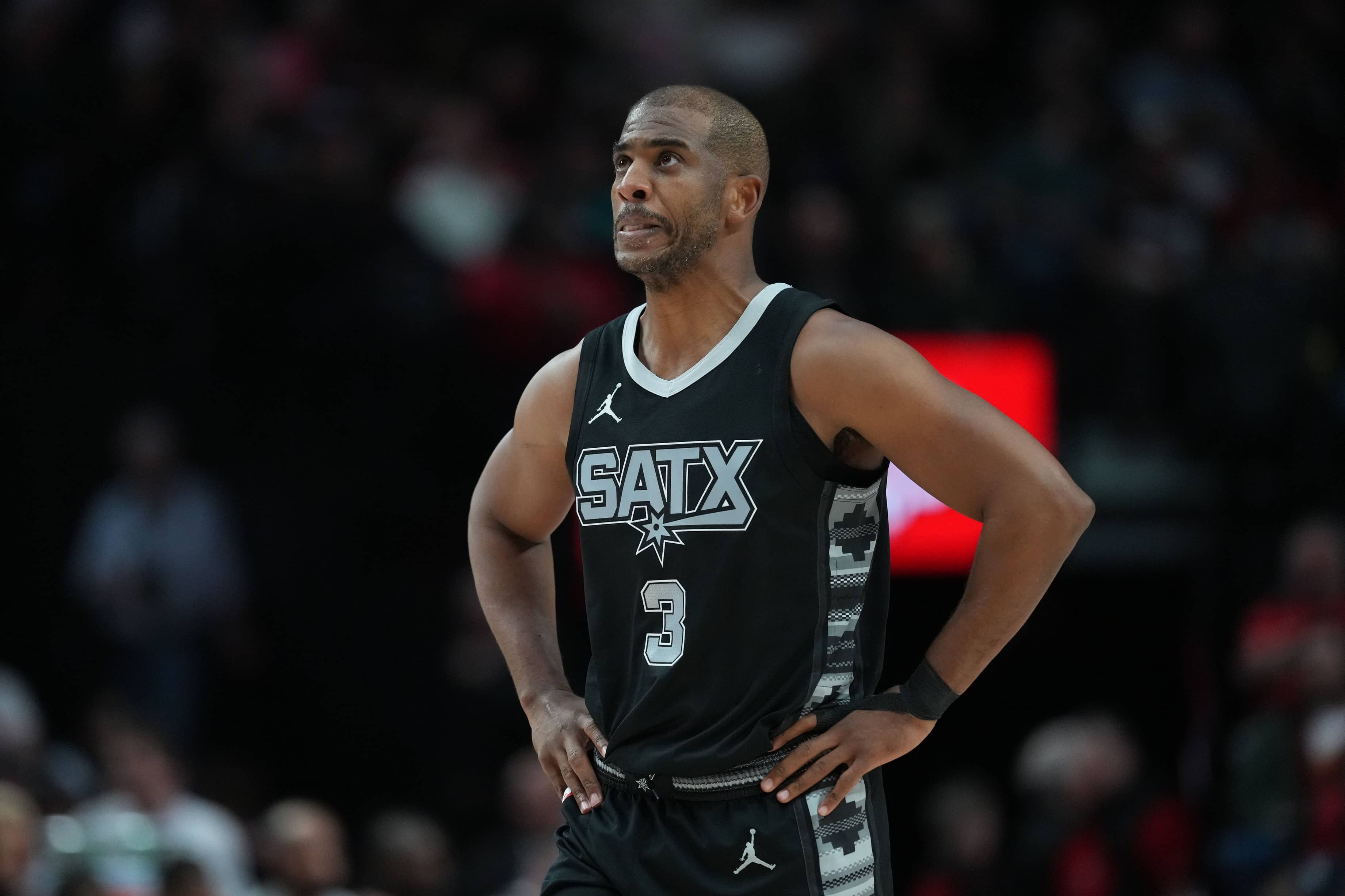 Apr 6, 2025; Portland, Oregon, USA; San Antonio Spurs point guard Chris Paul (3) looks on during the first half against the Portland Trail Blazers at Moda Center.