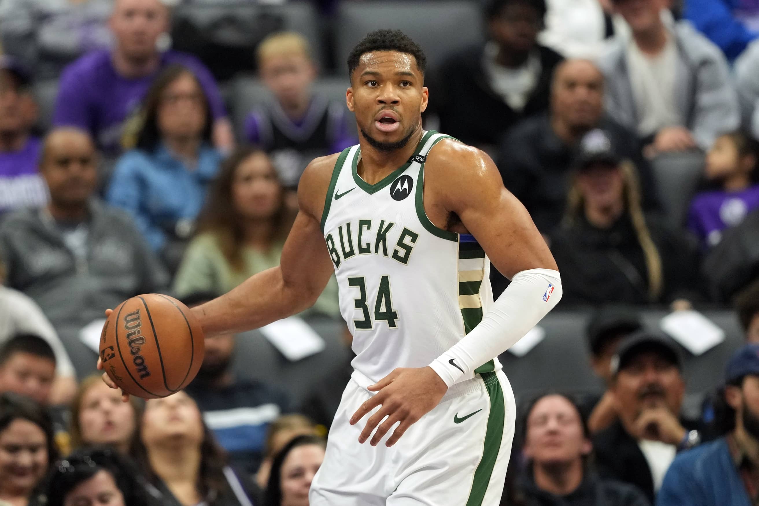 Mar 22, 2025; Sacramento, California, USA; Milwaukee Bucks forward Giannis Antetokounmpo (34) handles the ball against the Sacramento Kings during the first quarter at Golden 1 Center. Mandatory Credit: Darren Yamashita-Imagn Images