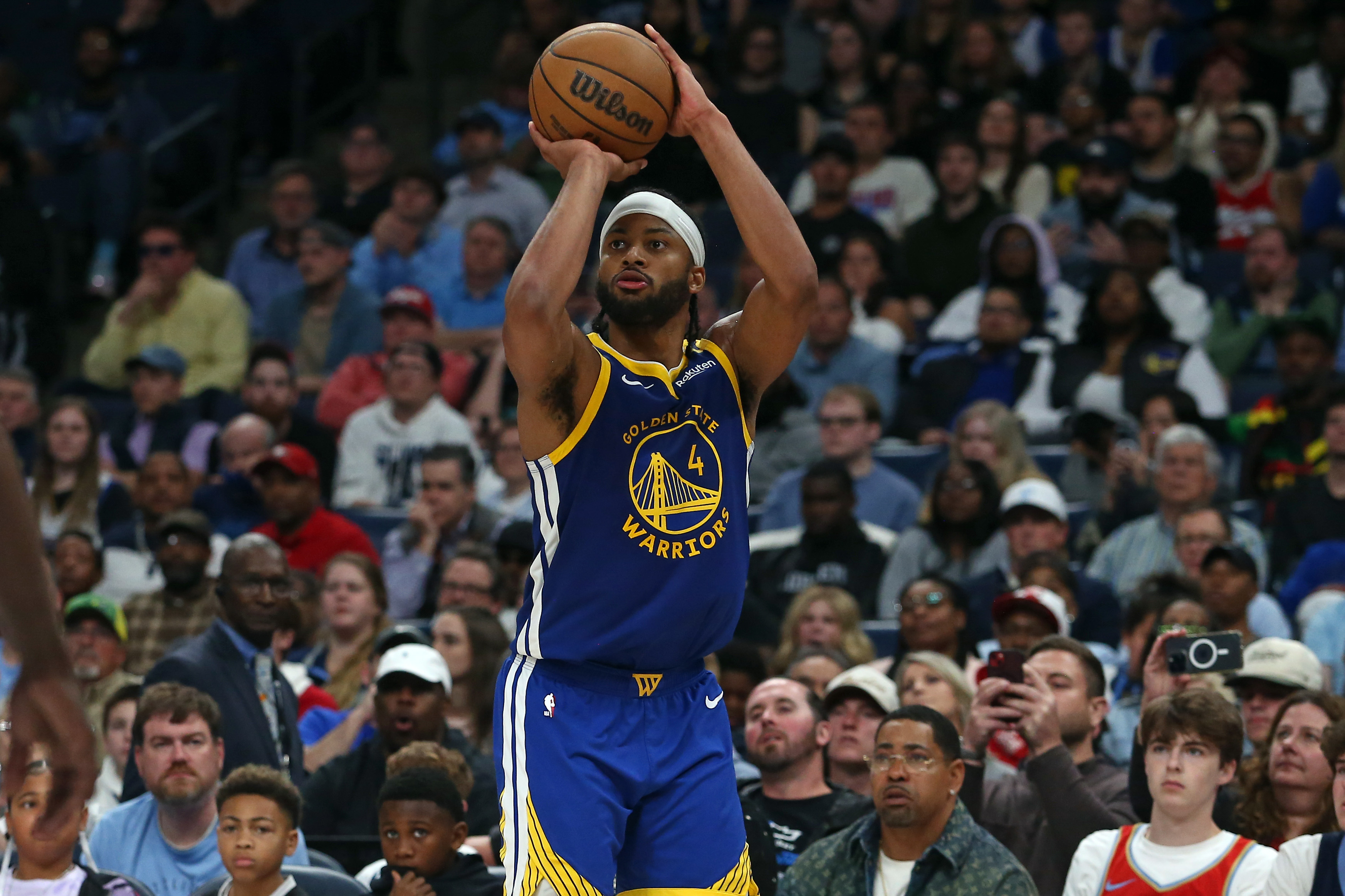 Apr 1, 2025; Memphis, Tennessee, USA; Golden State Warriors guard Moses Moody (4) shoots for three during the fourth quarter against the Memphis Grizzlies at FedExForum. Mandatory Credit: Petre Thomas-Imagn Images  