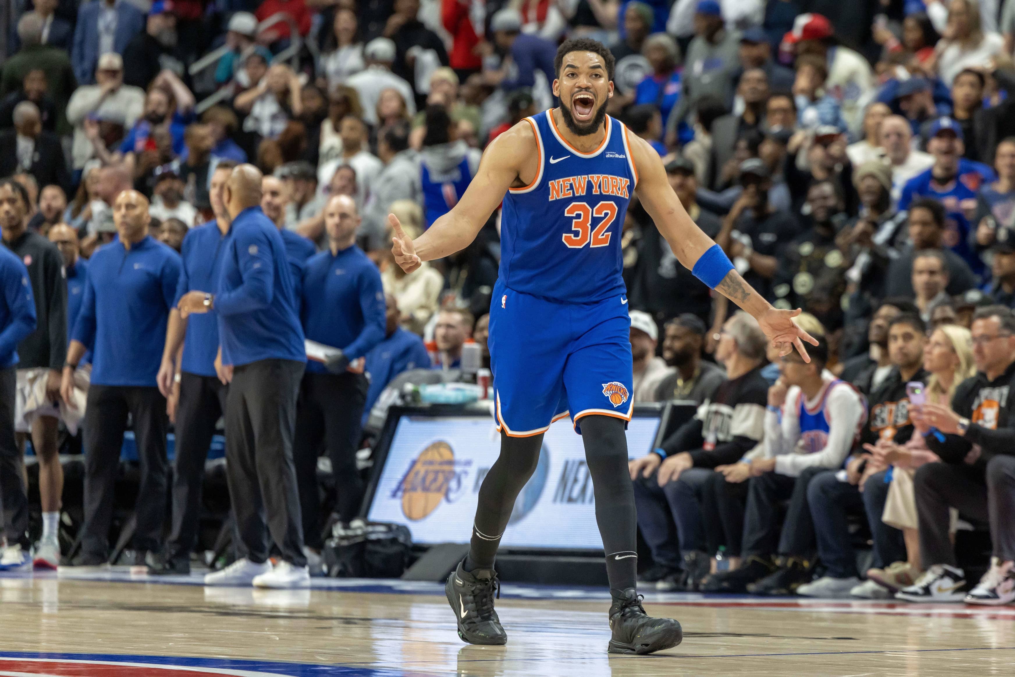 Apr 27, 2025; Detroit, Michigan, USA; New York Knicks center Karl-Anthony Towns (32) hits a three point basket late in the fourth quarter of game four of first round for the 2025 NBA Playoffs against the Detroit Pistons at Little Caesars Arena. Mandatory Credit: David Reginek-Imagn Images