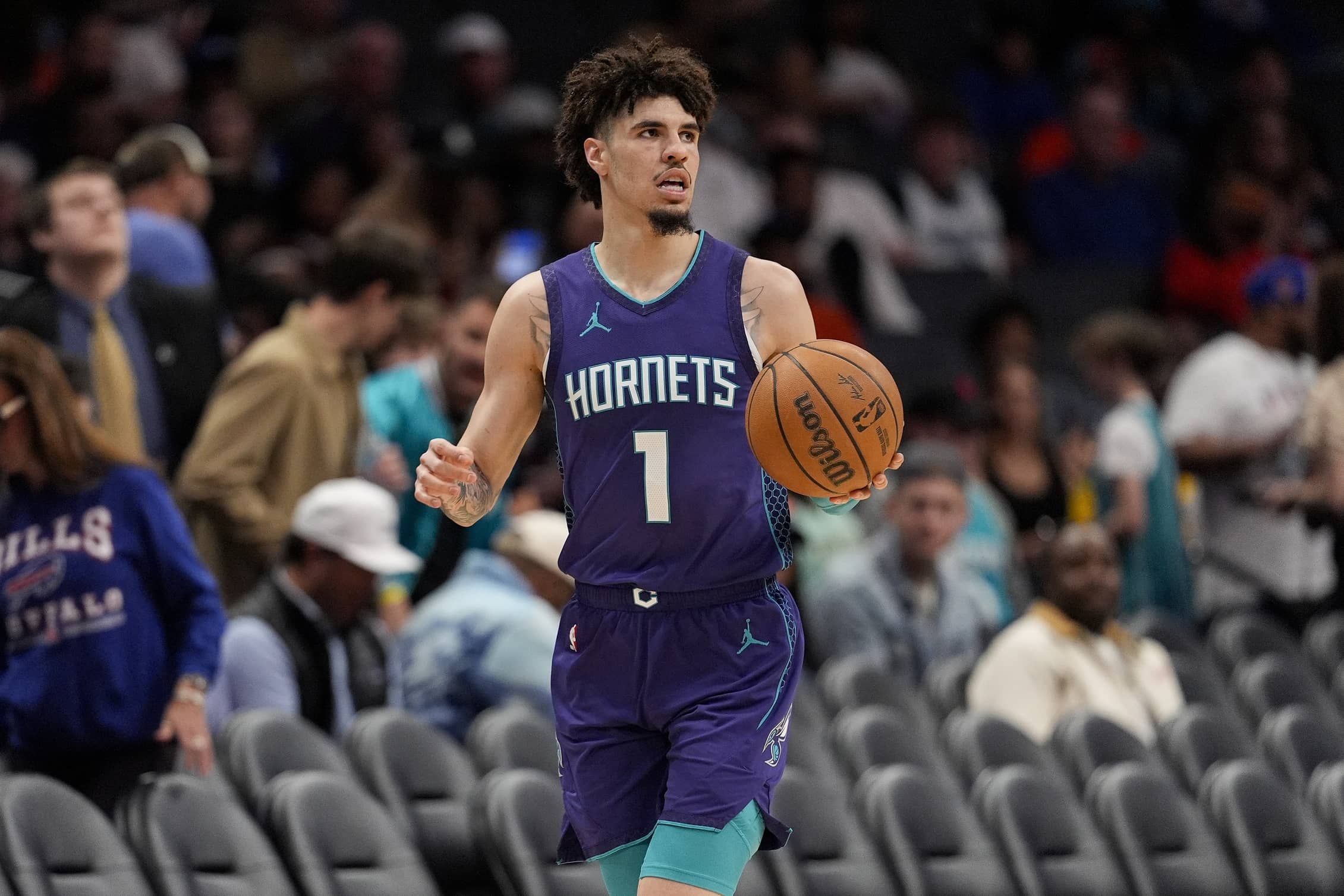 Mar 20, 2025; Charlotte, North Carolina, USA; Charlotte Hornets guard LaMelo Ball (1) brings the ball up court against the New York Knicks during the second half at Spectrum Center. Mandatory Credit: Jim Dedmon-Imagn Images