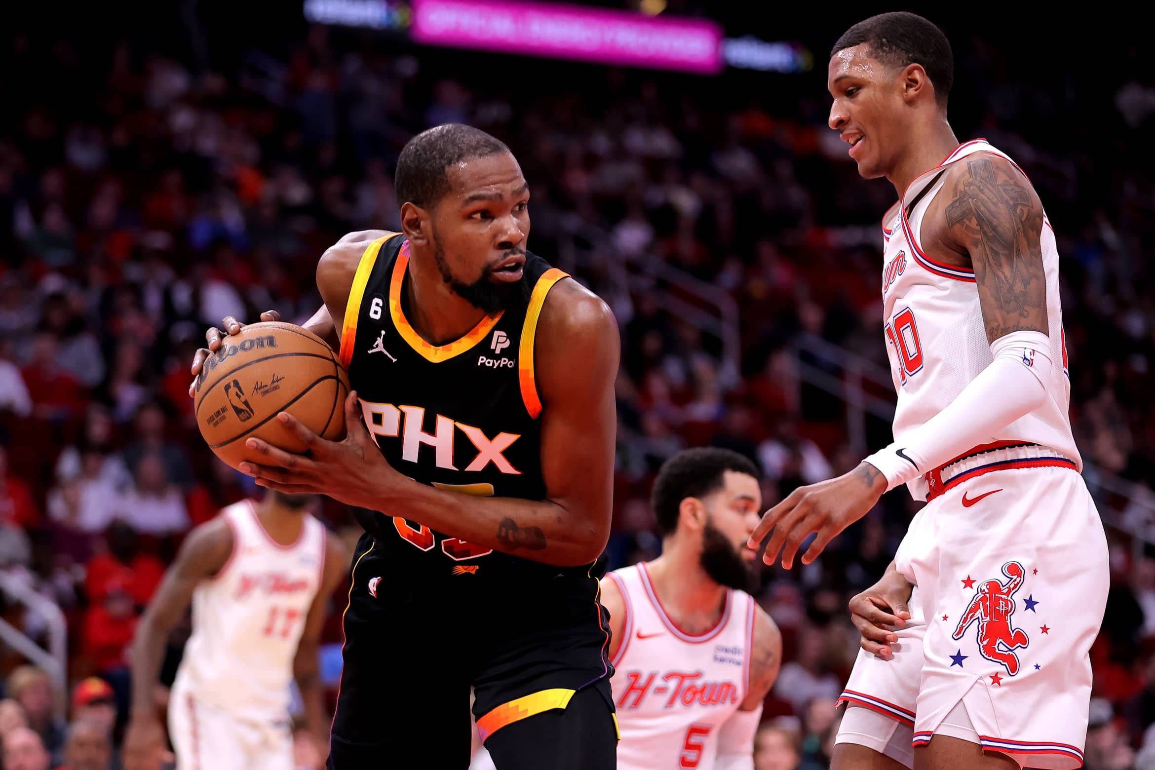 Phoenix Suns forward Kevin Durant (35) rebounds against Houston Rockets forward Jabari Smith Jr. (10) during the first quarter at Toyota Center.