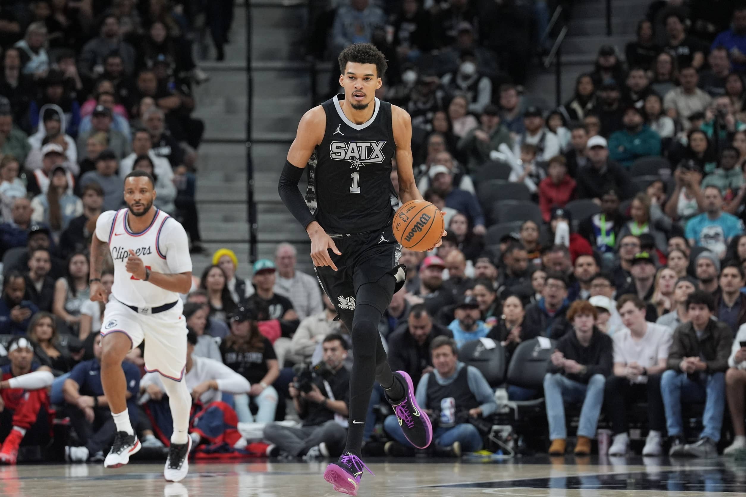 Jan 29, 2025; San Antonio, Texas, USA; San Antonio Spurs center Victor Wembanyama (1) dribbles the ball up in the second half against the LA Clippers at Frost Bank Center. Mandatory Credit: Daniel Dunn-Imagn Images