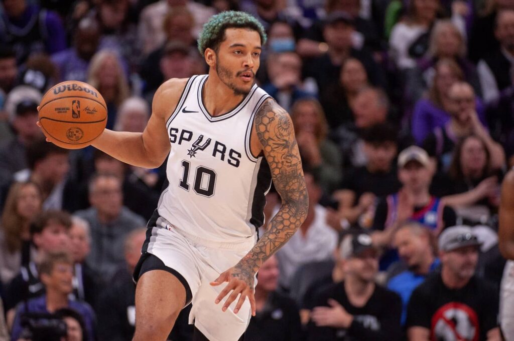 Nov 16, 2025; San Antonio, Texas, USA; San Antonio Spurs forward Jeremy Sochan (10) dribbles up the court in the first half against the Sacramento Kings at Frost Bank Center. Mandatory Credit: Daniel Dunn-Imagn Images