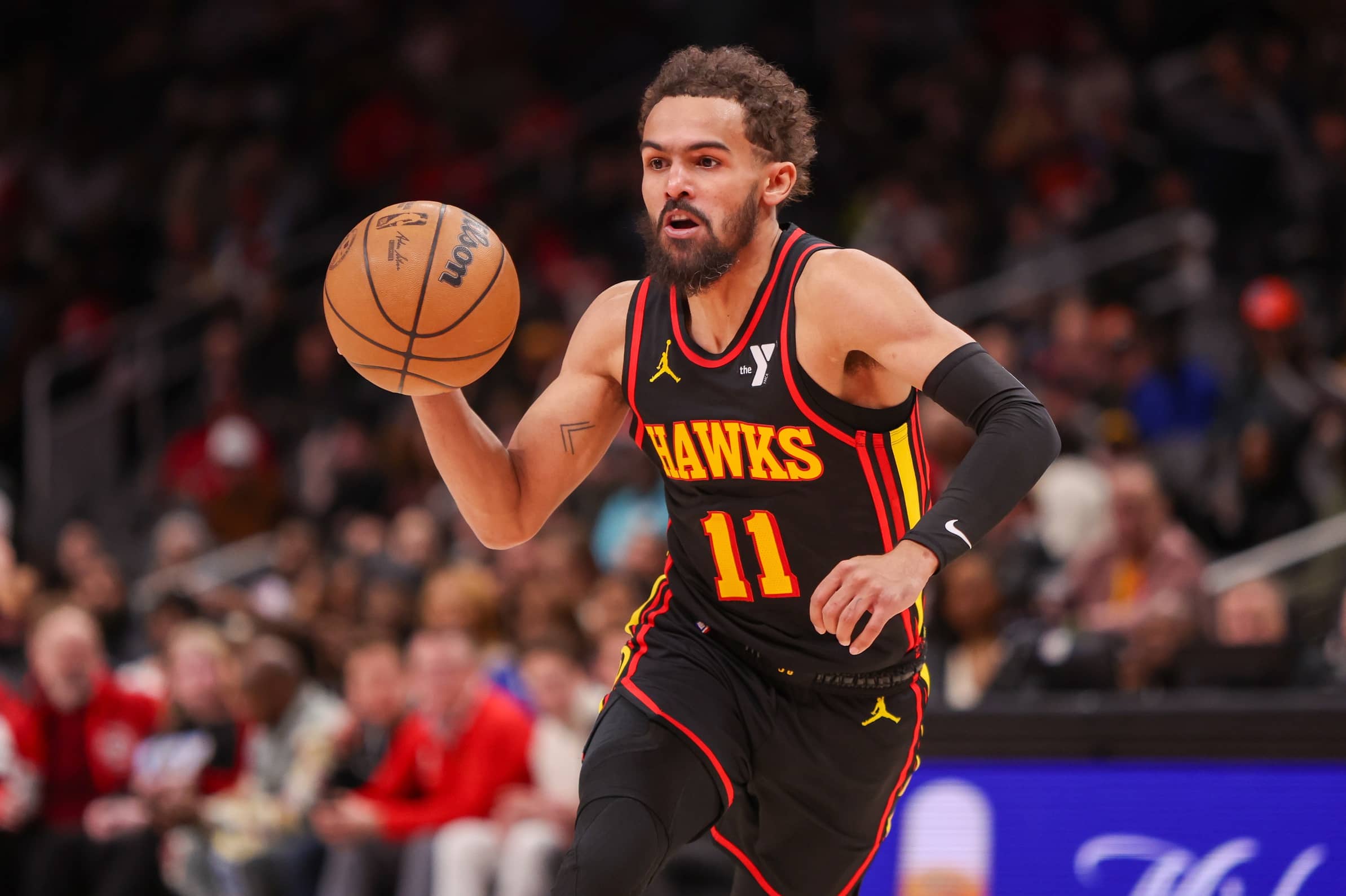 Jan 23, 2025; Atlanta, Georgia, USA; Atlanta Hawks guard Trae Young (11) drives to the basket against the Toronto Raptors in the second quarter at State Farm Arena. Mandatory Credit: Brett Davis-Imagn Images