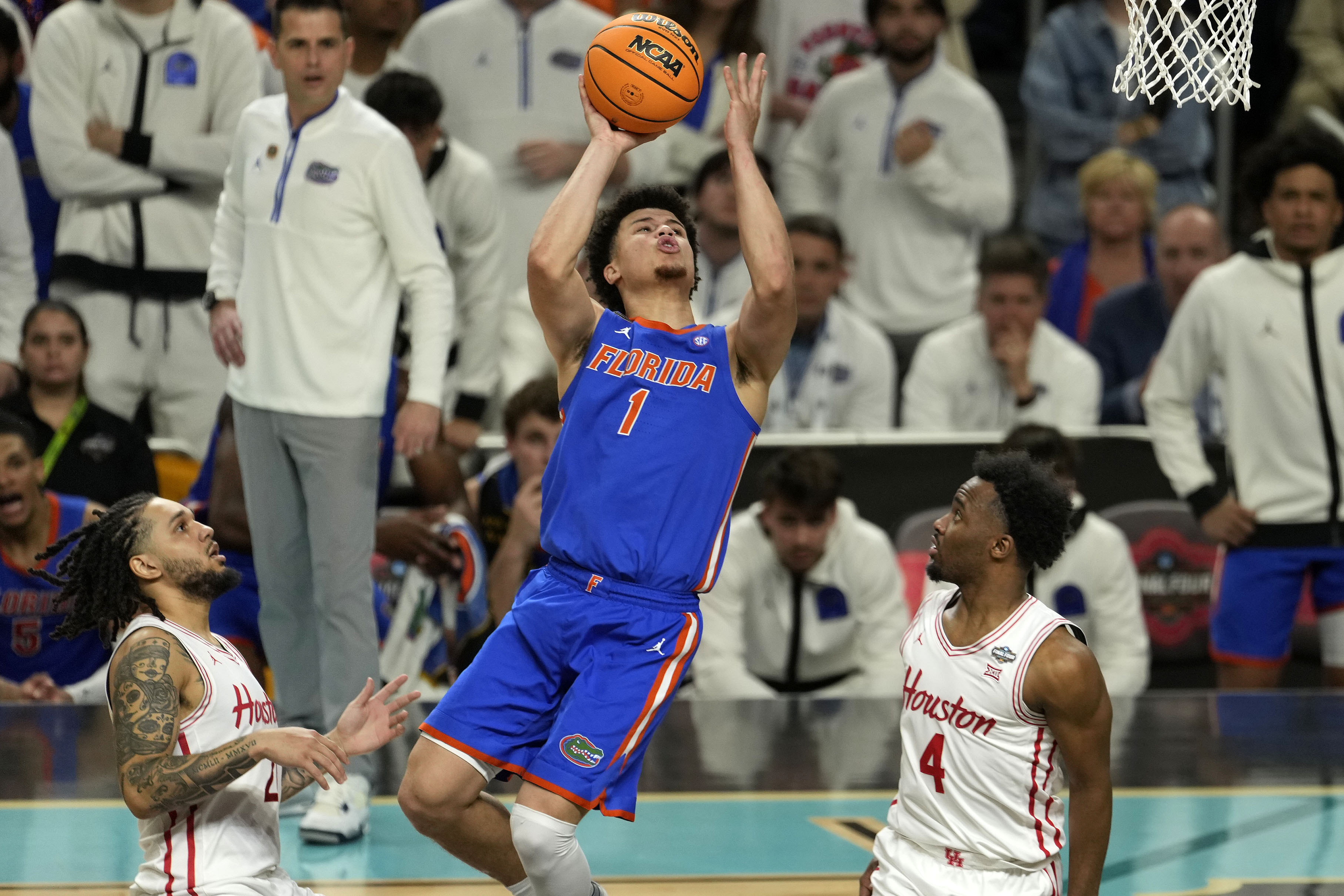 Apr 7, 2025; San Antonio, TX, USA; Florida Gators guard Walter Clayton Jr. (1) shoots the ball against Houston Cougars guard L.J. Cryer (4) during the second half in the national championship game of the Final Four of the 2025 NCAA Tournament at the Alamodome. Mandatory Credit: Scott Wachter-Imagn Images