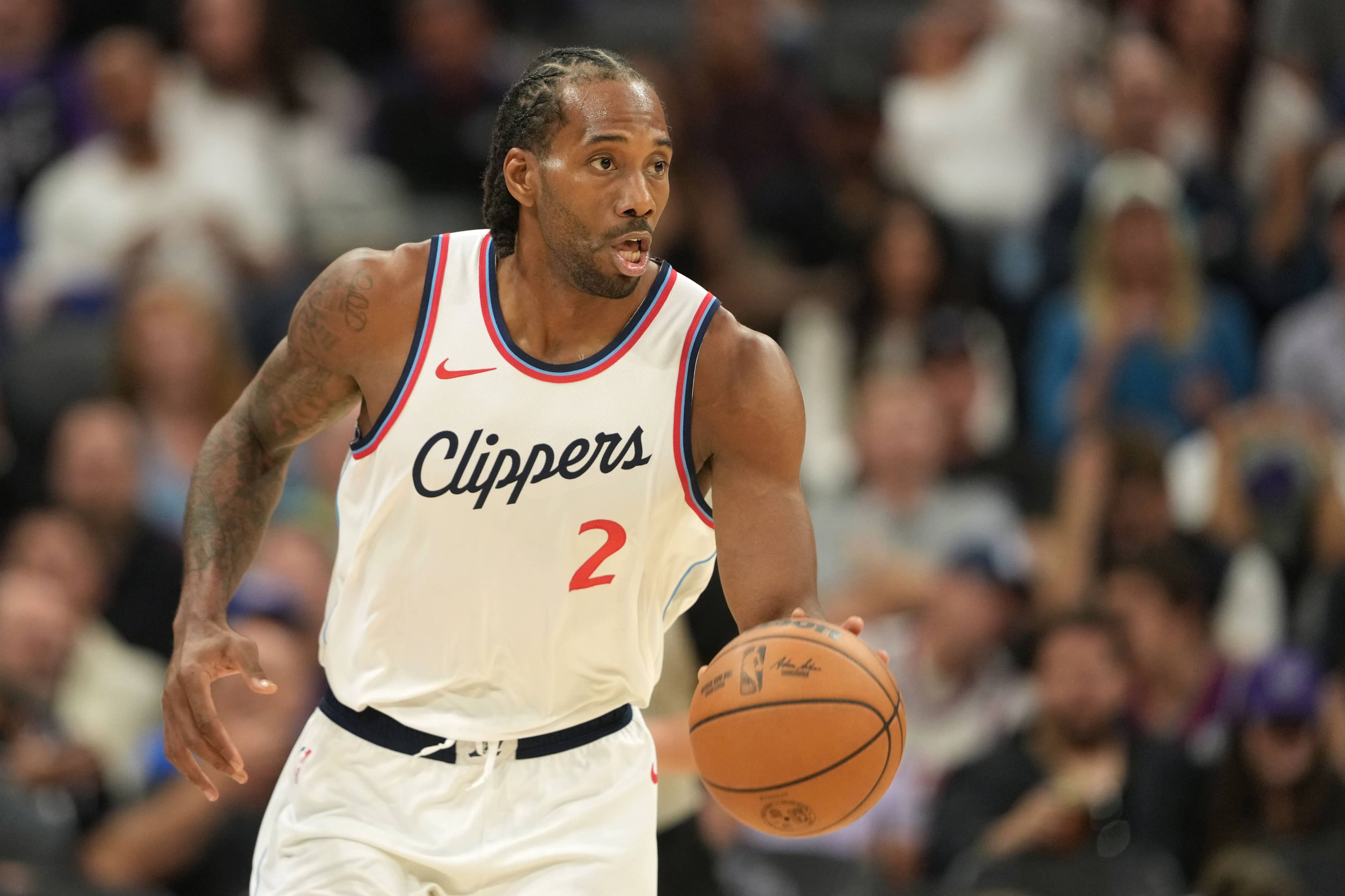 Sacramento, California, USA; Los Angeles Clippers forward Kawhi Leonard (2) dribbles against the Sacramento Kings during the fourth quarter at Golden 1 Center.