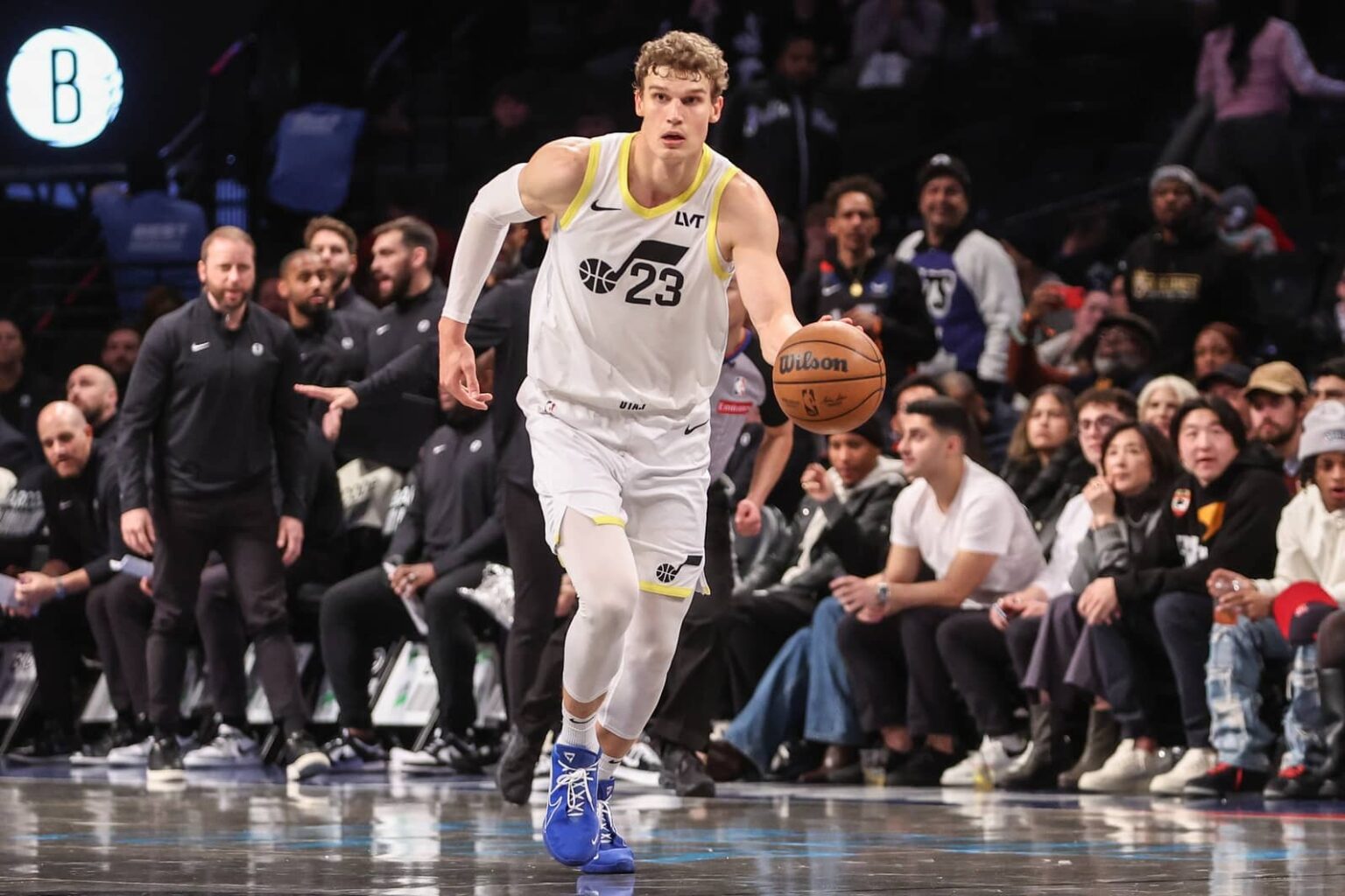 Lauri Markkanen (23) pushes the ball up the court during a game against the Brooklyn Nets.
